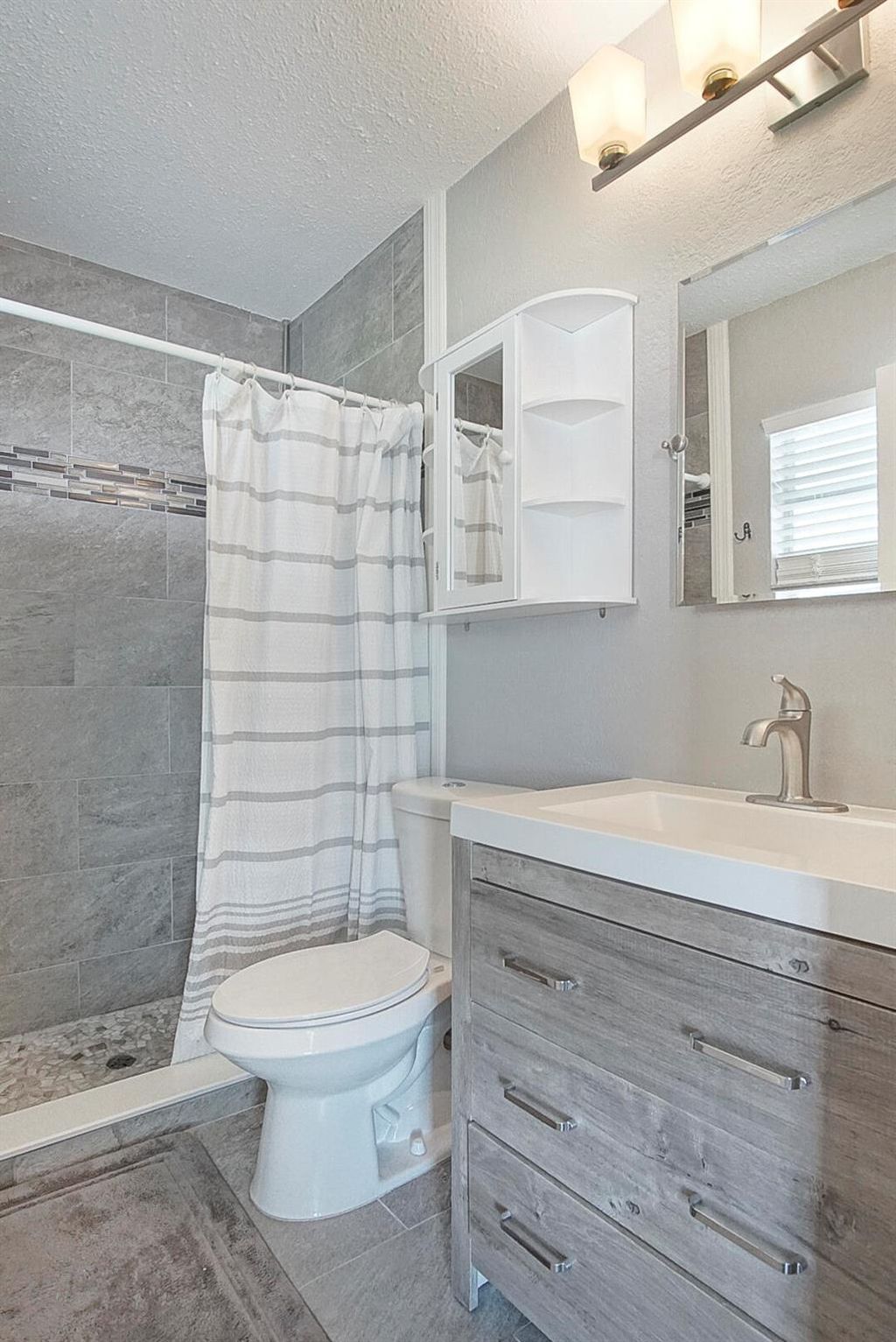 Photo of 733 SW Babbit Drive, Port Saint Lucie, FL 34953 (MLS # R10947066)