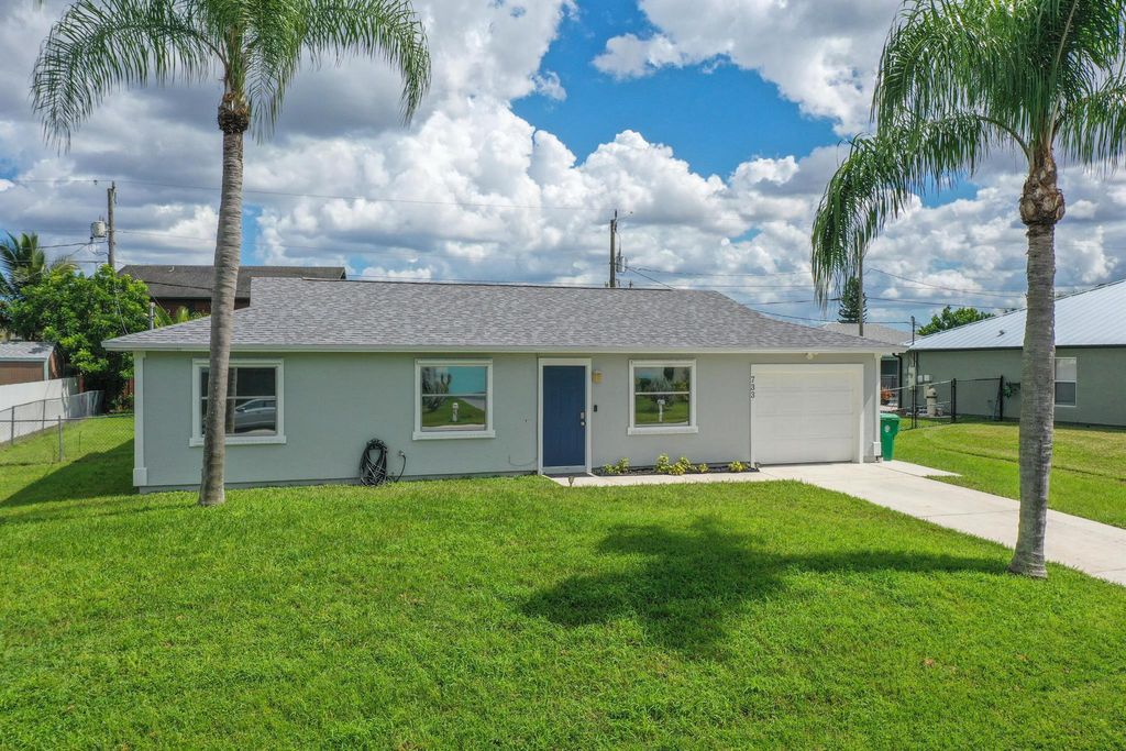 Photo of 733 SW Babbit Drive, Port Saint Lucie, FL 34953 (MLS # R10947066)