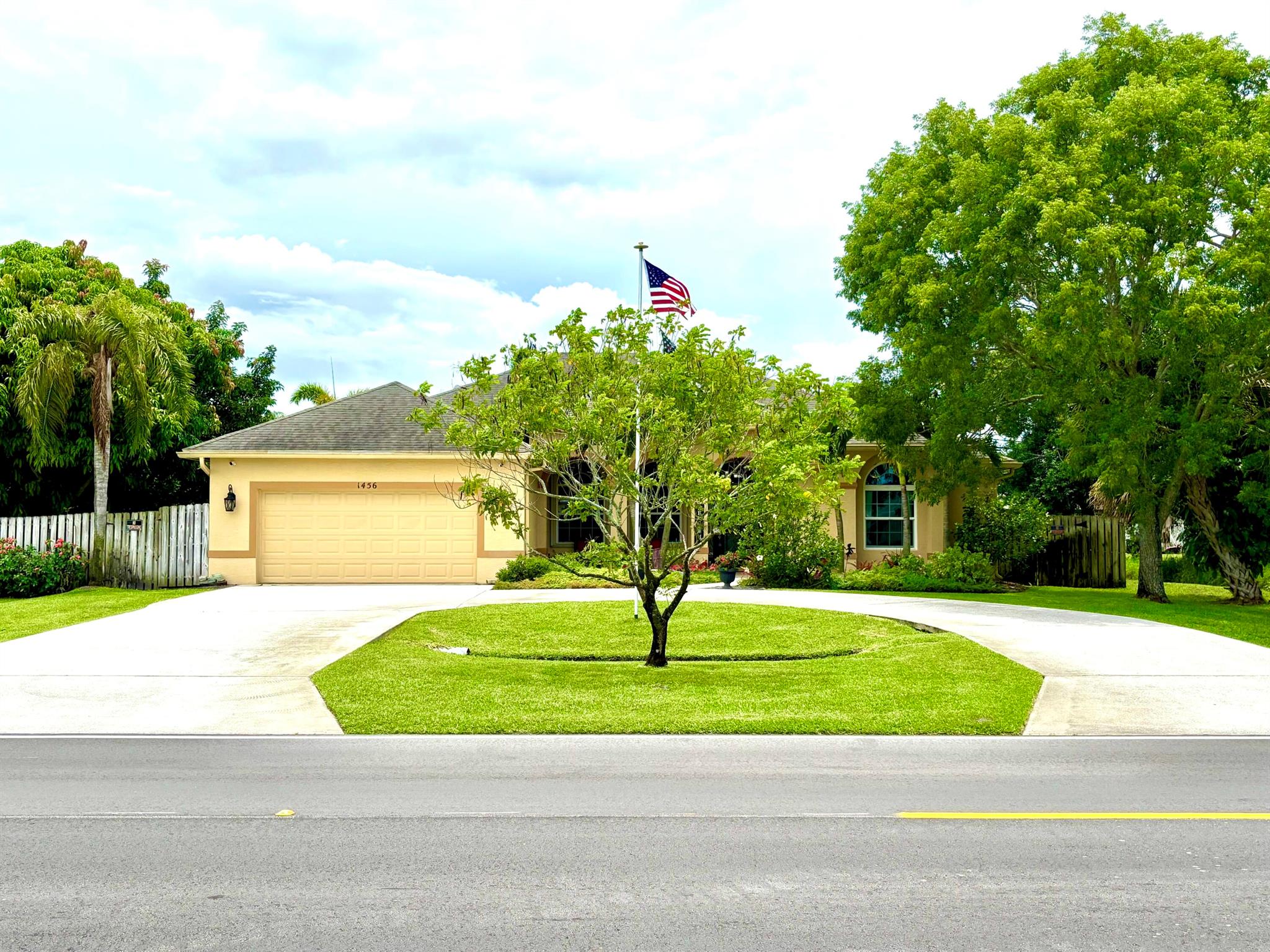 Privacy! No immediate neighbors! This Florida retreat offers space, comfort, and a thoughtful design. With 2,400 sq ft of open living space, it is perfect for a growing family who appreciates private space. Soaring ceilings connect the gourmet kitchen--complete with corian countertops and stainless steel appliances--to a spacious living area. Step outside to an oversized screened-in pool with a spa which waterfalls into the pool, a covered patio with ceiling fans, and lush landscaping that creates a private, garden-like oasis ideal for gatherings or quiet mornings alike. This home includes central vac throughout, accordion shutters, and an impact window in the front of the house. This beauty can be purchased in combination with the adjacent vacant lot. MLS: RX-11096956, Seller is Motivated