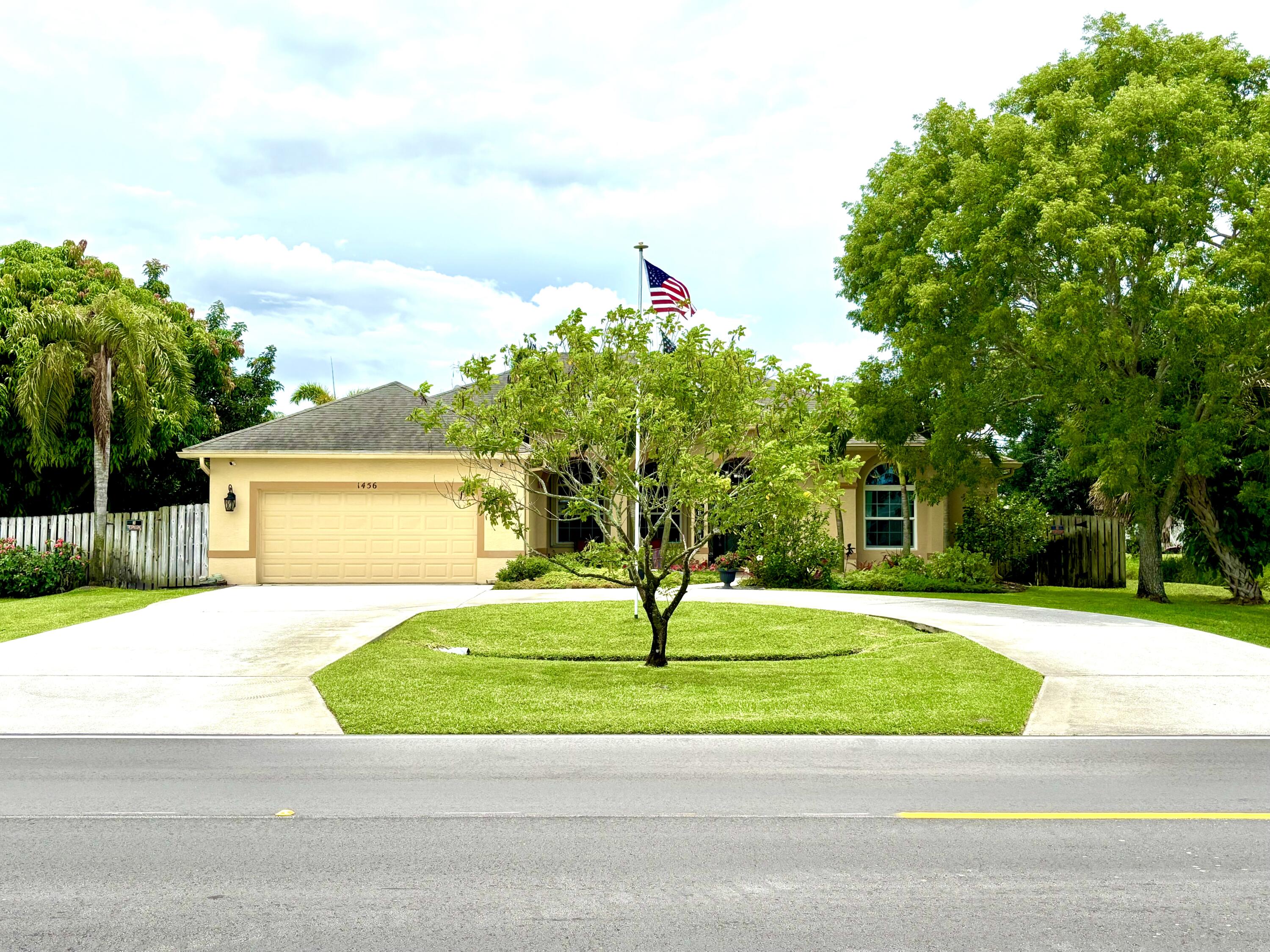 NEW ROOF to be installed! This Florida retreat offers space, comfort, and ultimately: privacy! With 2,400 sq ft of open living space, it is perfect for a growing family who appreciates private space. Soaring 12' ceilings connect the gourmet kitchen--complete with stainless steel appliances--to a spacious living area. Step outside to an oversized screened-in saltwater pool with a spa, a covered patio with ceiling fans, and lush landscaping that creates a private, garden-like oasis, ideal for gatherings or quiet mornings alike. This home includes central vac throughout, accordion shutters, and an impact window in the front of the house. This home can be purchased individually or in combination with the adjacent vacant lot. MLS: RX-11096956.