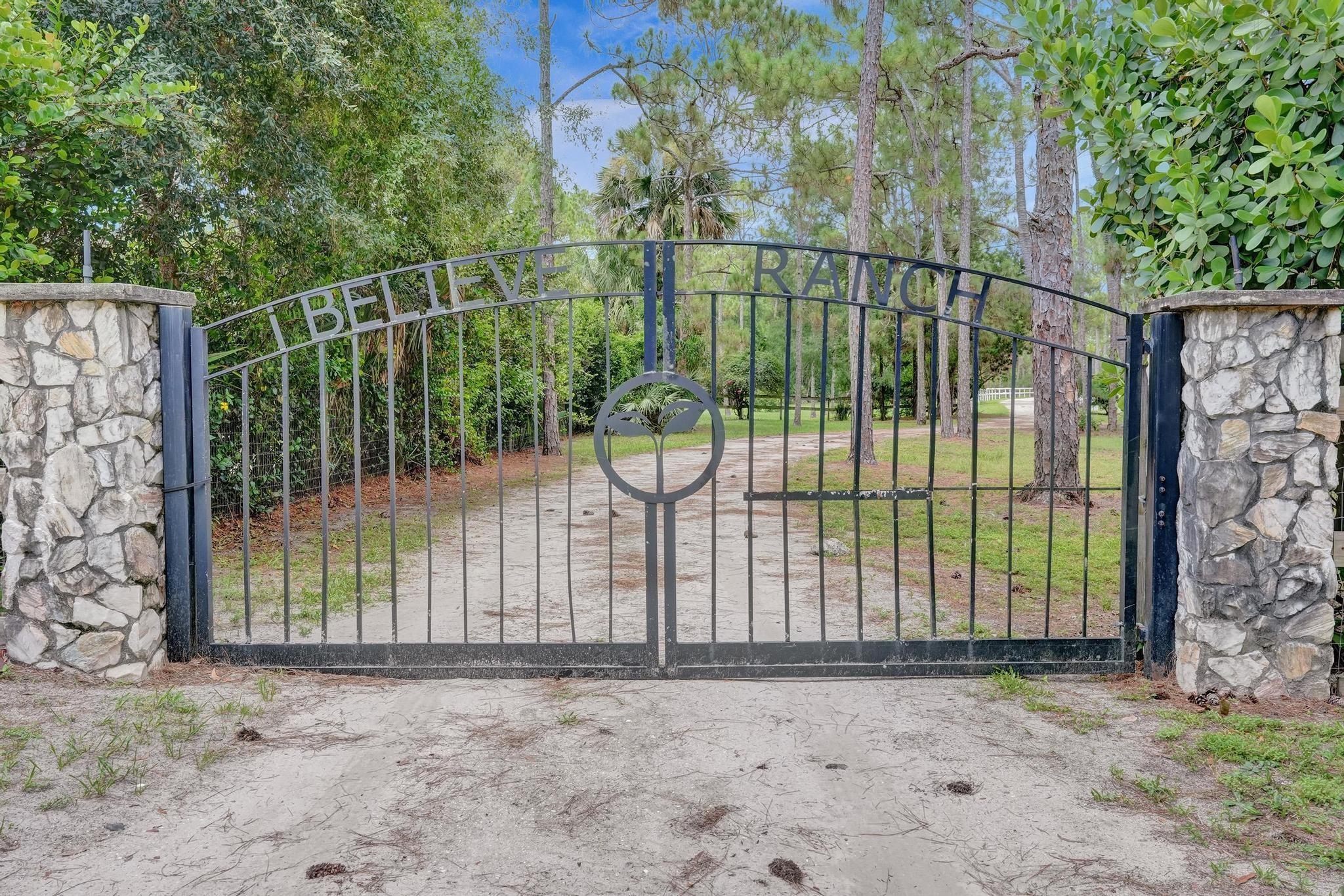 Majestic 10.5 acres offers rare opportunity w/no HOA , Direct access to 30 miles of equestrian and hiking trails, Impeccable 3 bedroom split plan with all new gourmet kitchen,soaring two story ceilings, french doors, fireplace, new contemporary primary bath, luxury vinyl flooring, updated 2ndary baths,wood beam ceilings, breakfast bay window. A true must-see for country living close to city. Surrounding the pond is a custom covered Pavilion with bathroom and pizza oven. The property also boasts a workshop with bath,storage garage, chicken coop, exotic fruit trees, bridge to meditation island,gazebo, fire pit, zip line, and electric with pad for another home. A unique and beautiful place to live.