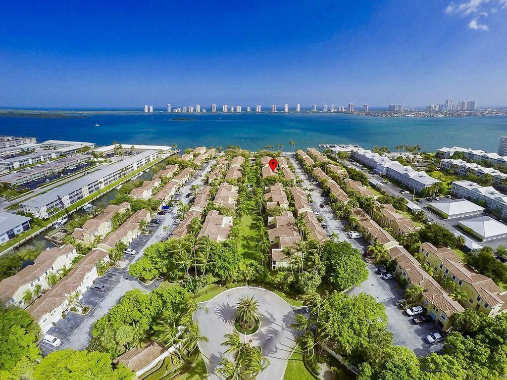 Photo of 1035 Lake Shore Drive #202, Lake Park, FL 33403 (MLS # R10758766)