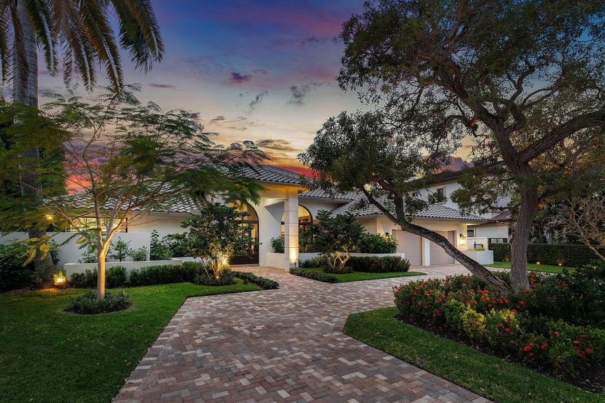 Experience the pinnacle of modern living in this fully renovated, single-story home in the prestigious Royal Palm Yacht & Country Club. Completely reimagined for both comfortable living and style, the gorgeous home features a split floor plan with four generously sized bedrooms, including a spacious master suite with a private sitting area and a fabulous spa-inspired bath. The heart of the home is the chef's kitchen, which boasts exquisite quartzite countertops, premium Thermador appliances, a morning bar, and thoughtful design elements ideal for culinary pursuits or casual entertaining. Adjacent to the kitchen, the formal dining room is enhanced by designer lighting and custom storage and offers an elegant space for hosting gatherings.