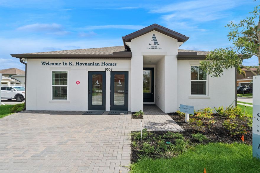 The Finlay II plan is a beautiful plan with 4BR, 2 BA, 2 Car garage. This Finlay was used as our decorated model and will be the last opportunity to purchase a K. Hovnanian home at Aspire at Morningside. This home is located on a corner lot in the original section of the community, away from the current construction zone. As a model, it features many desirable upgrades including ceramic tile throughout, a home surveillance and alarm system, and high impact windows. 
This well-designed home showcases a spacious peninsula-style kitchen with Ash Gray 42'' upper cabinets, Arctic White Quartz countertops, upgraded GE Profile stainless steel appliances and undercabinet lighting. The open floorplan extends into a bright, airy great room with expansive windows, while the dining area connects seamlessly to the covered patio. 
The elegant primary suite features a spa-inspired bath with dual vanities and a generous walk-in closet. Three additional bedrooms offer ample space for family, guests, or a home office. Added conveniences include irrigation with St. Augustine grass, a washer and dryer, whole-home gutters, and a two-car garage with opener.
Aspire at Morningside is a vibrant community boasting a state-of-the-art fitness center, sparkling outdoor pool, basketball court, and kid's tot lot. Ideally situated between downtown Fort Pierce and Tradition in Port St. Lucie, you're minutes from premier shopping, dining, entertainment, and renowned golf courses such as Fairwinds and Indian Hills. Whether you're enjoying a peaceful sunset stroll or connecting with neighbors at the clubhouse, this community offers an exceptional lifestyle.
Don't miss your opportunity to own this one-of-a-kind home. The Finlay II blends luxury, livability, and thoughtful design into one beautifully crafted package.