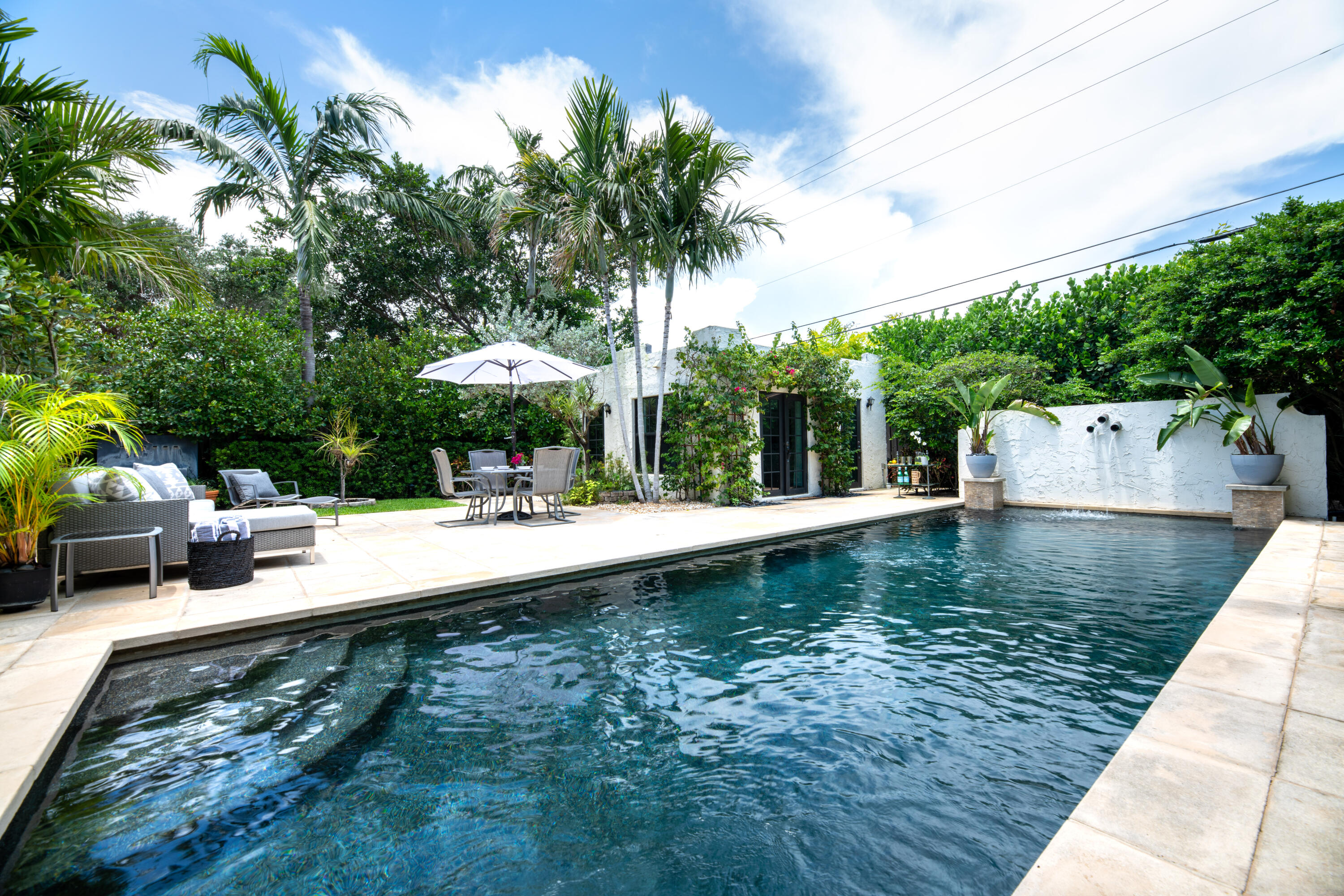 Beautifully Renovated Historic Mediterranean East of Olive in SoSoLocated east of Olive Avenue in West Palm Beach's popular SoSo neighborhood, this stunning 3-bedroom, 2-bathroom historic Mediterranean home features a fully detached guest suite with a private full bathroom. The main house blends original architectural charm with modern upgrades, including impact-rated doors and windows throughout.The chef's kitchen boasts high-end appliances, a gas range, and custom cabinetry. Enjoy a resort-style saltwater pool surrounded by lush private landscaping, along with a convenient cabana bath for ideal indoor-outdoor living.