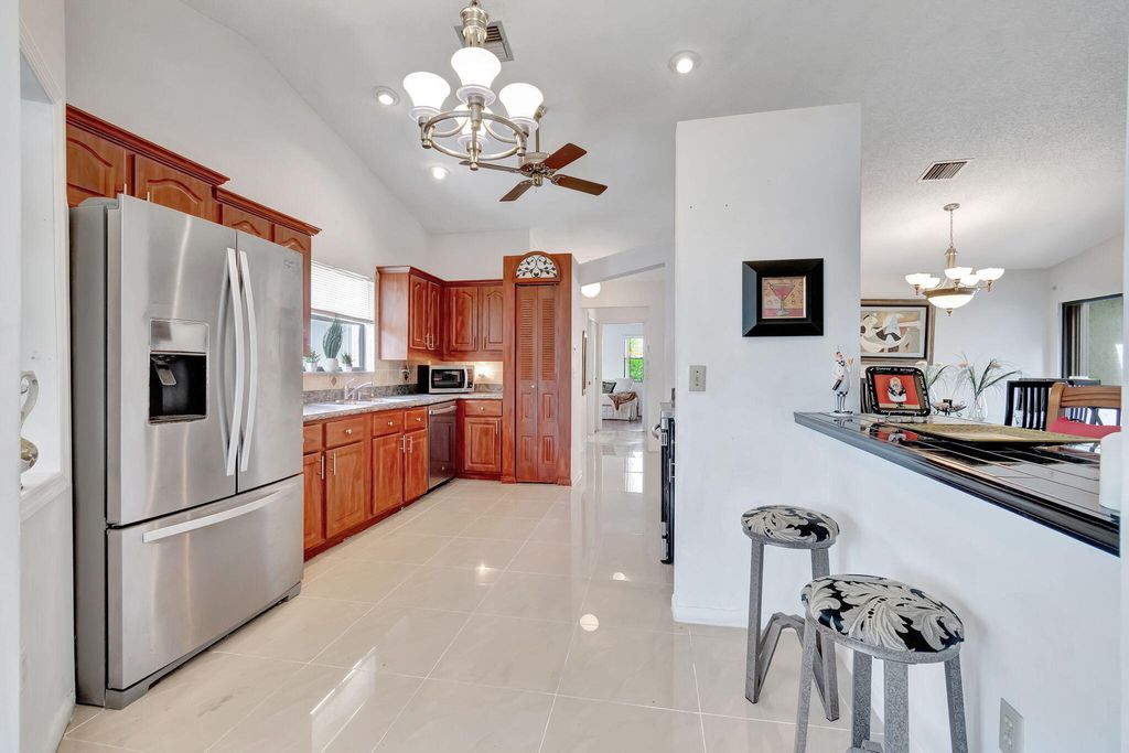 Photo of 1345 NW 25th Lane, Delray Beach, FL 33445 (MLS # R10997038)
