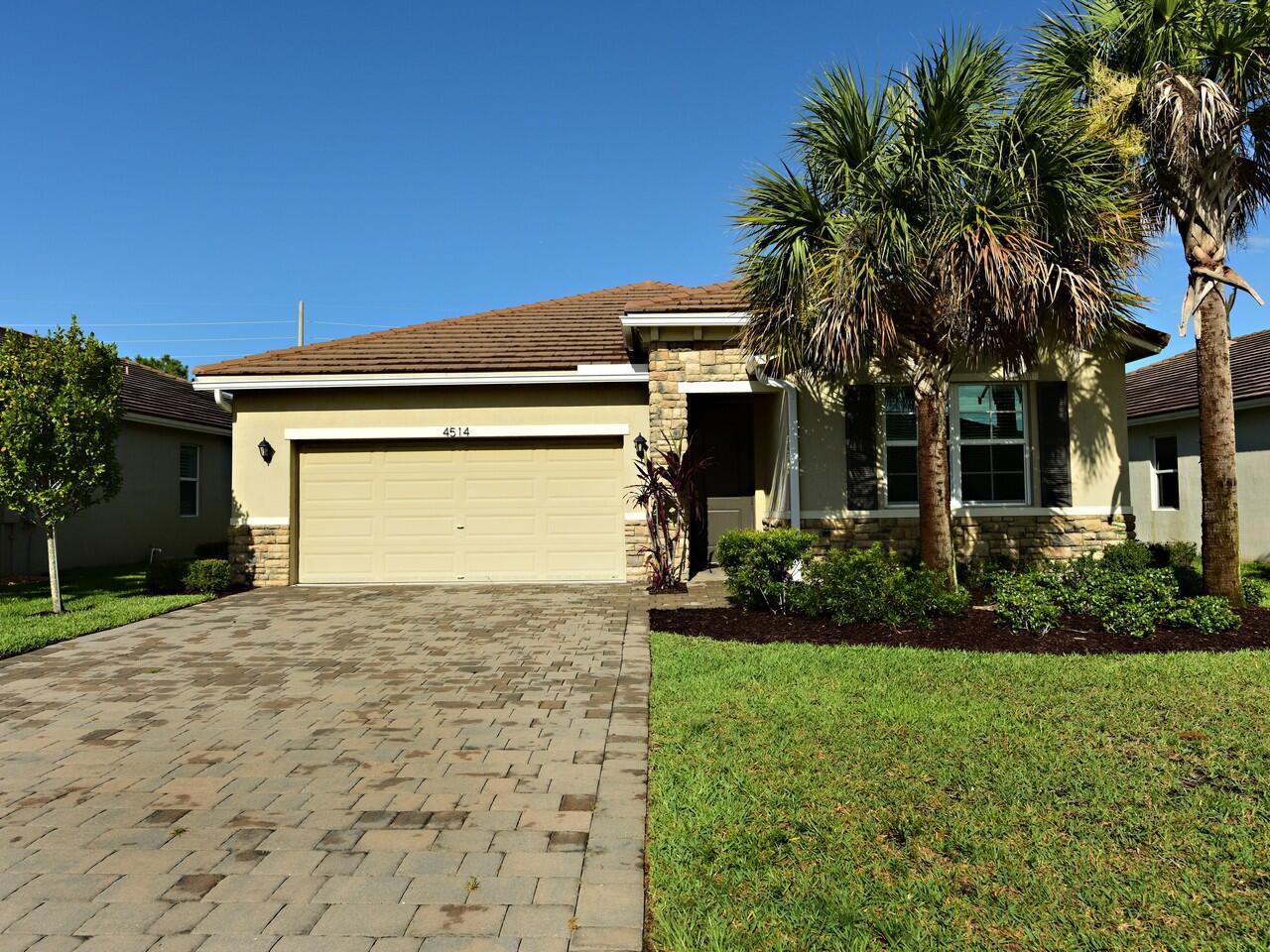 Stunning Concrete Home in Prime Jensen Beach Location! Nearly new 2BR + Den (easily 3rd BR) nestled on a private wooded preserve. Enjoy 1,808 SF under air with a split open floor plan, plank flooring, and impact windows/doors. Chef's kitchen features Quartz counters, center island, walk-in pantry & decorative backsplash. Relax on the peaceful covered porch. Den with French doors is perfect as an office or guest room. Smart home security system included! Located in a gated community with pools, clubhouse, restaurant, bar, golf & tennis. Just minutes to beaches, shopping, and mall. Concrete tile roof = lasting value!