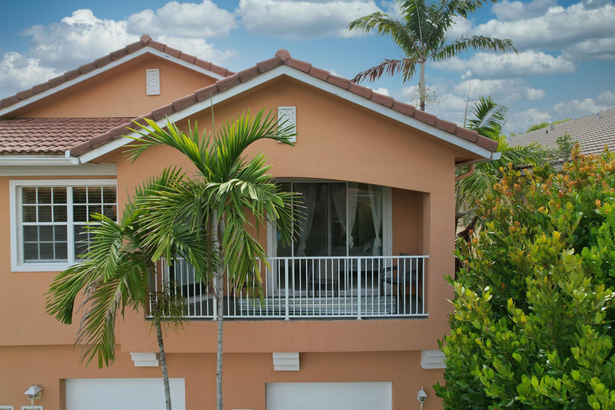 Charming 2-Bedroom, 2-Bathroom Townhouse with Lake View in Gated Community. Don't miss this beautifully maintained end unit townhouse located in a peaceful, gated community with security guard on premises. Just minutes from the beach, shopping centers, and restaurants, this home offers convenience and comfort.Enjoy serene lake views from the balcony and vaulted ceilings that enhance the spacious feel. The home offers brand-new kitchen appliances, and a newer air conditioning system equipped with UV light and a 10-year warranty. The washer and dryer are conveniently located near both bedrooms. This townhouse is ideally situated directly across from the newly renovated community pool, and picnic area--perfect for relaxation and entertaining. The attached garage includes a dedicated stora