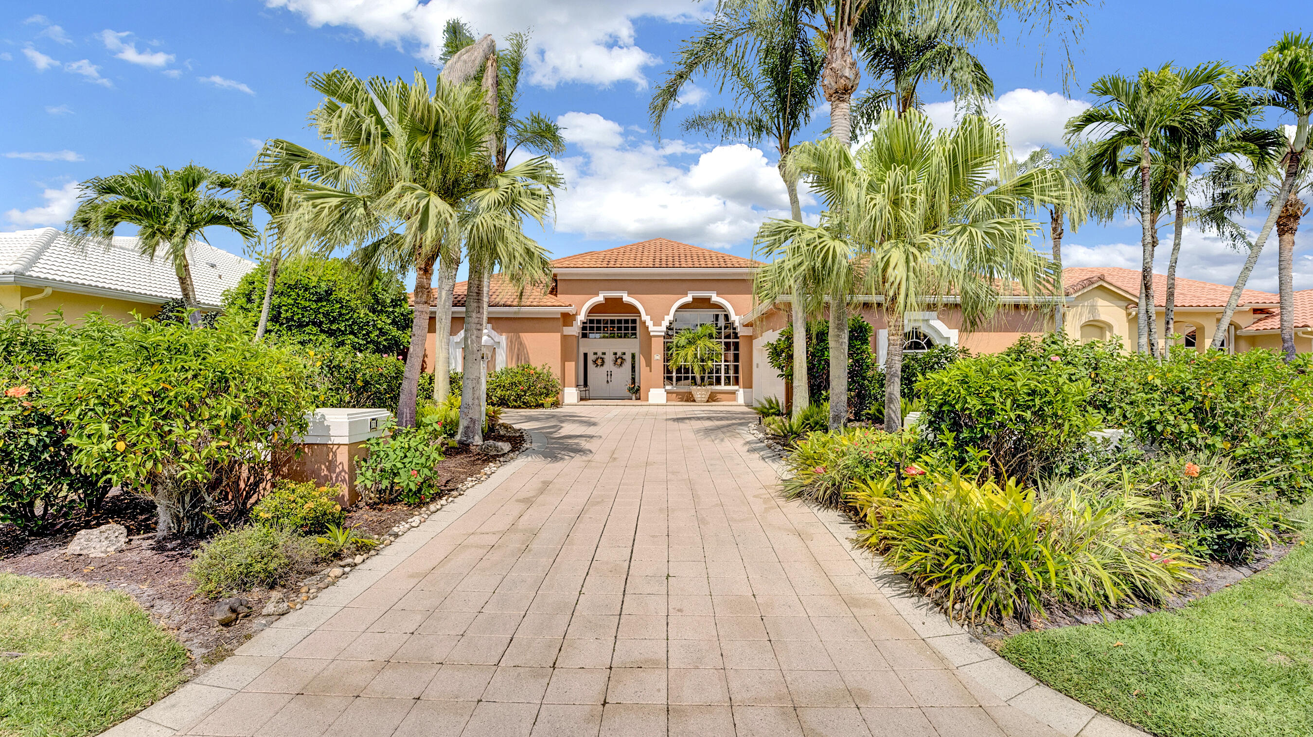 Rarely available for rent in The Island is this stunning home in PGA National! Surrounded by preserves, serene lakes, and world-class golf courses, this gem is perfectly situated. As you step inside, you're greeted by breathtaking views of the pool and lake, vaultd ceilings, and an inviting open floor plan. The master suite located on one side of the home, features large windows and sliding glass doors that open to the pool and patio, offering picturesque lake views. The en-suite bathroom has been beautifully renovated with a spacious walk-in shower, dual vanities, and a custom oversized linen closet for ample storage. On the opposite side of the house, the second and third bedrooms share a Jack and Jill bathroom. The versatile 4th bedroom overlooks the pool and opens to the living room.