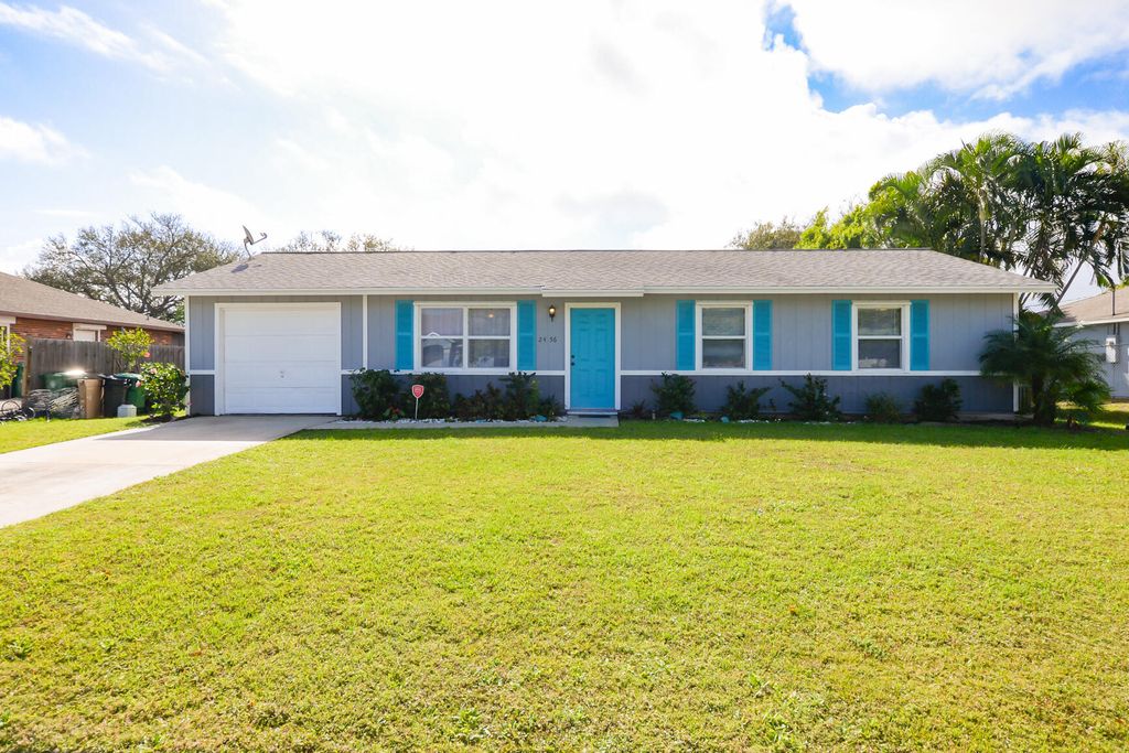 Photo of 2456 SE Melaleuca Boulevard, Port Saint Lucie, FL 34952 (MLS # R10777988)