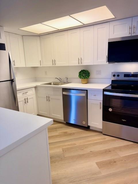 BEAUTIFULLY RENOVATED 1ST FLOOR UNIT offering an exceptional price and opportunity for ownership! This charming one-bedroom, one-bathroom condo showcases luxury vinyl coastal color flooring, new kitchen w/brand new appliances and large island, a screened patio and the added convenience of an in-unit washer and dryer. Prime and ideal location with close proximity to downtown Jensen Beach vibrant dining, scenic causeway and picturesque beach. Quiet and pet-friendly community offering lower HOA fees, two expansive pools (one heated), a clubhouse, picnic areas with BBQ stations, billiards and a library. Great investment potential with flexible rental terms permitting 30 day rentals-four times a year with no waiting period to rent.