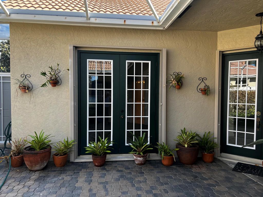 Photo of 840 SW Lake Charles Circle, Port Saint Lucie, FL 34986 (MLS # R11000890)