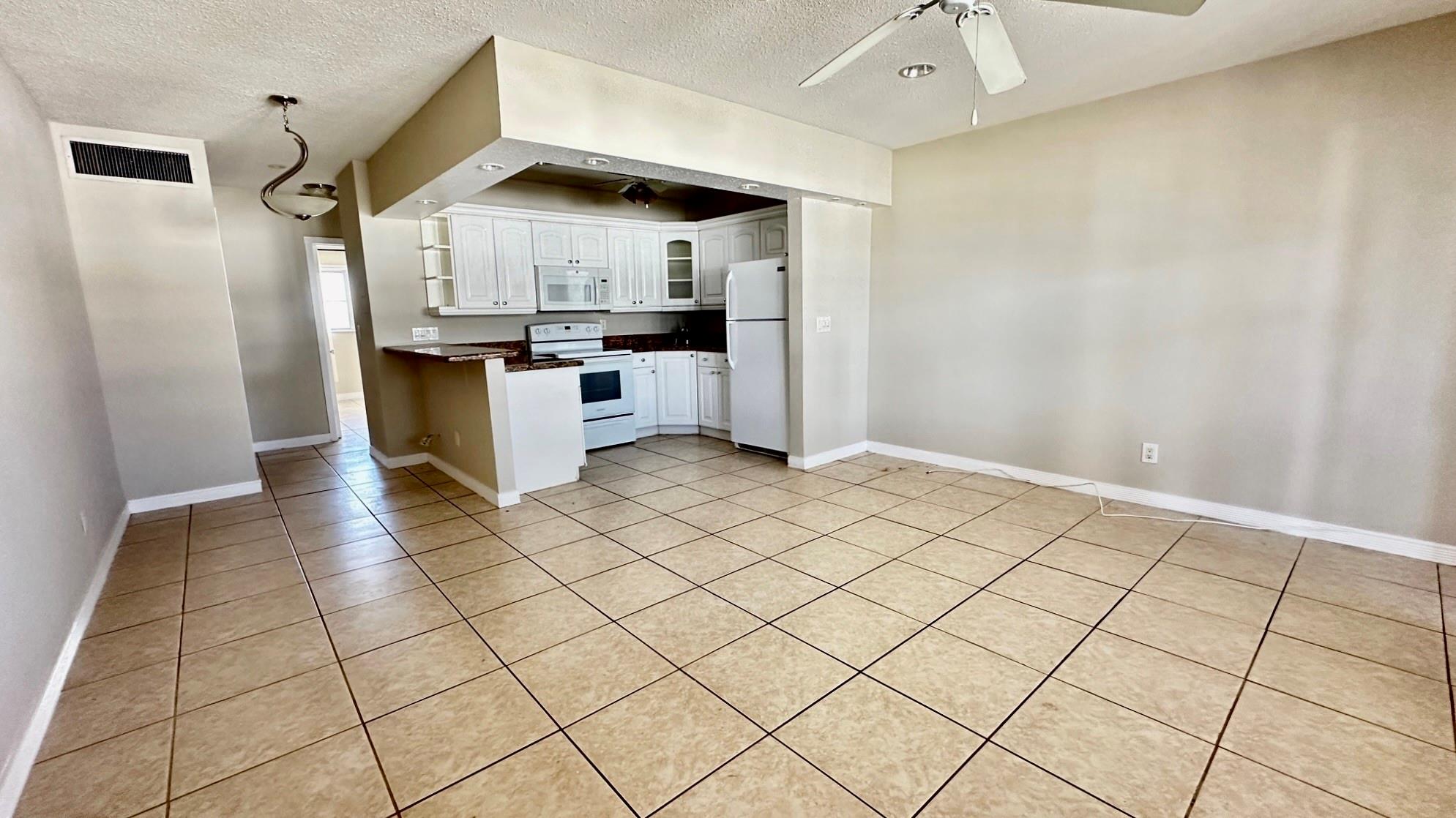 Spacious one-bedroom, one-bath apartment located on the top floor of a three-story building with an elevator. Nice kitchen featuring a granite kitchen counter and wood cabinets. There is plenty of closet space available, and laundry facilities are on-site. Enjoy great amenities, including a pool, jacuzzi, and shuffleboard. Water and basic cable are included in the rent. A credit score of 650 is required for at least one tenant. We are only asking for the first month's rent and a security deposit to move in. Please note that no pets are allowed per HOA regulations; emotional support animals are considered on a case-by-case basis.