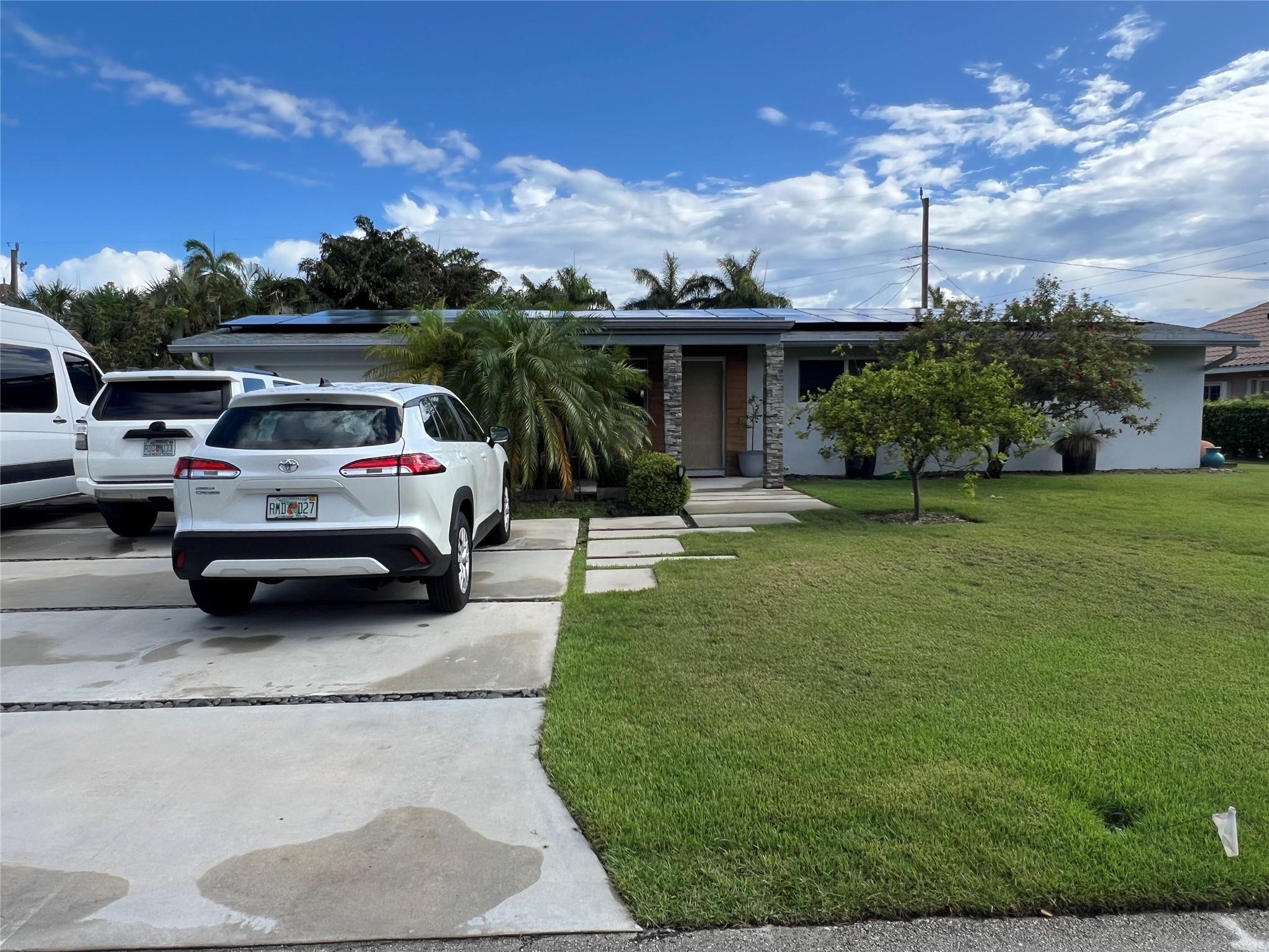 Available for seasonal or long term lease, this Beautiful and Spacious 4-bedroom, 2-bath home just a short walk to the beach comes with a spacious, lush backyard perfect for relaxing or entertaining. This inviting rental offers 4 bedrooms, 2 bathrooms, tile throughout, jacuzzi, fruit trees, only a few blocks to The Cove plaza, with all the comfort, convenience, and a serene outdoor retreat—all less than a mile to the beautiful Deerfield Beach pier.