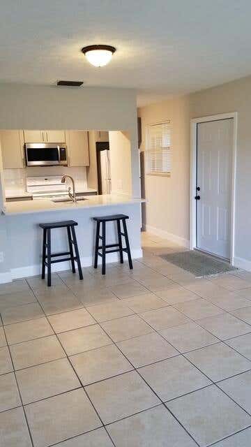 Photo of 6537 SE FEDERAL HWY 102 Highway SE #102, Stuart, FL 34994 (MLS # B26059389)