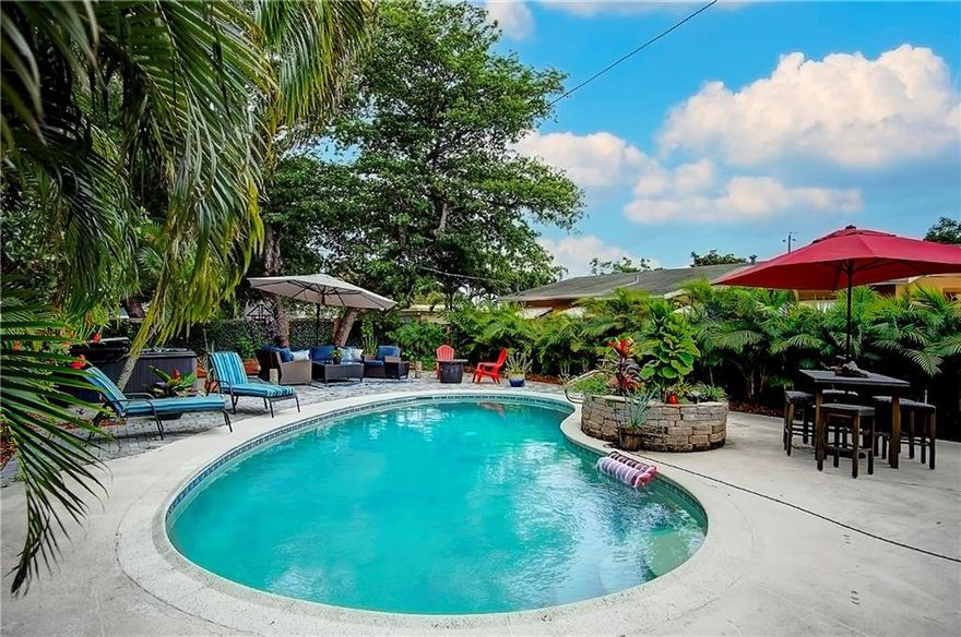 This home is beautiful! A turn-key three bed, two bath pool home in Oakland Park just two blocks from the Culinary Arts District. Although a three bed home, the expanded living area can be turned back into office/4th bed. The property features a large primary bedroom with sitting area, open kitchen and a laundry room. New impact windows and impact front door. The roof is only 2 years old. New hot water heater, new AC, and new pool filtration system. The extremely private back garden is huge, featuring a pool & hot tub, a goldfish pond and a large decked patio area for entertaining. The property is being sold furnished with decor (inside and out). Most of the furniture, decor, and TVs in the home are less than a year old. New Outdoor grill and new $1500 robot pool vacuum included.