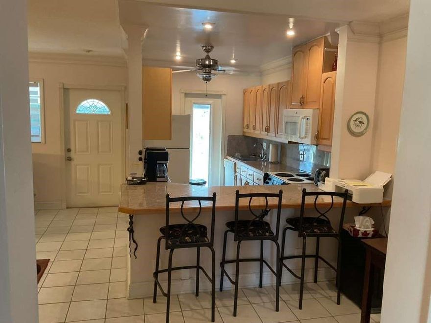 Beautifully appointed 55+ unit located just east of US-1. This move-in-ready residence features tile flooring throughout, an open kitchen overlooking the living area, and a bright, well-maintained interior. The enclosed back porch offers serene views of the pool and landscaped garden. Community amenities include a pool, well-kept common areas, and convenient access to shopping, dining, and beaches.
No leasing. No pets. Easy to show—unit is on lockbox.