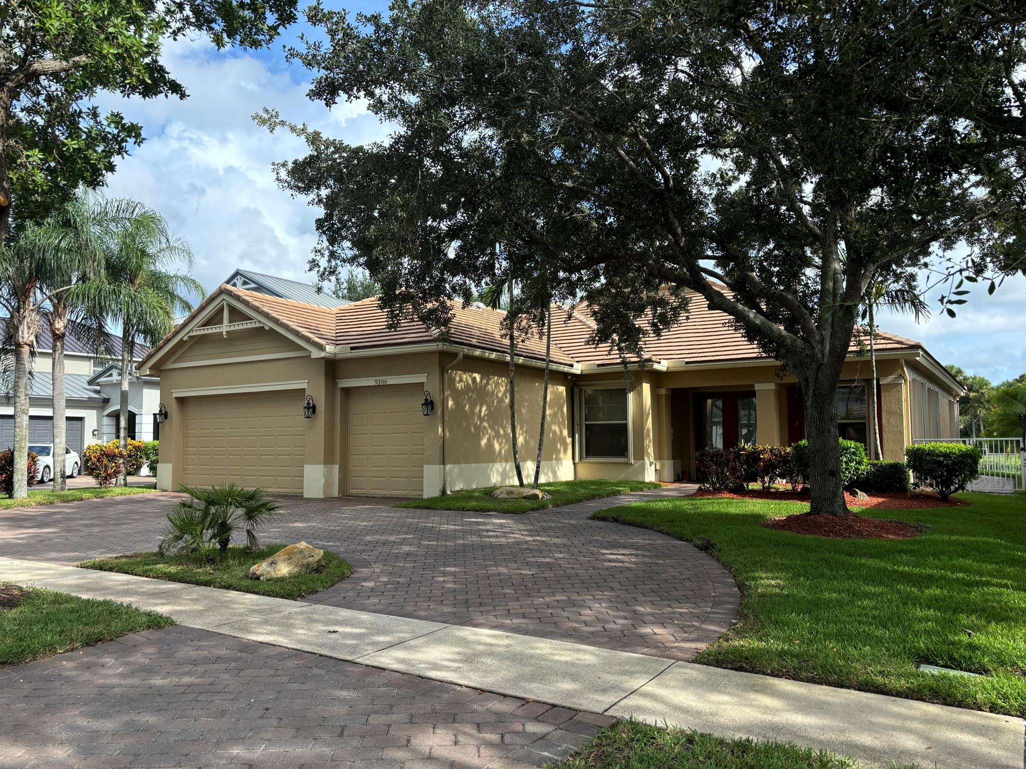 Perfect 5BR/3BA/3CG one level lakefront Estate pool home in the gated community of Palm Beach Plantation! Perfectly situated to the Wellington Green mall, shopping and restaurants, within minutes of the turnpike. Located in a family friendly neighborhood with lots of children, zoned for top rated schools. Split floor plan w formal LR, DR & FR, elegant millwork, ceramic tile/laminate flooring, tall doors/ceilings fantastic lake view salt water pool w coveted rear southern exposure! Additional features include paver circular/straight driveway, accordion shutters, trey ceilings, open kitchen, new double ovens & refrigerator, central vac, custom master closet, dual-zone AC units, covered screened lanai. This is more than a house, it's a home in a community that truly supports family living.