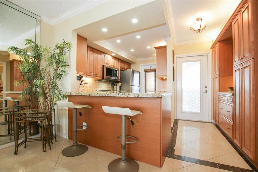 55+ Your heart will skip a beat when you enter this expertly remodeled condo with its immediate waterview of docked sailboats & boats of all sizes. Kitchen is wide open with abundant top-of-the line custom cabinetry, sleek  s/s appliances, extra wide granite counters. porcelain tile and special touches throughout. Both bathrooms are  remodeled to perfection.  Plantation shutters. Impact windows/shutters. Close to  Pompano Beach where excIting changes have been occurring: the new Pompano Beach fishing pier, Beach House restaurant,  new hotels, luxury condo complexes & the revitalization of Atlantic Blvd.  Pompano Beach with its wide sandy beach is listed as a top U.S. city destination.   The Greg Norman public golf course & clay tennis courts are nearby, Pompano Beach...the Happening Place!