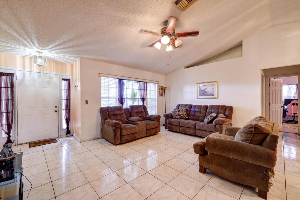 Photo of 3901 SW Jarmer Road, Port Saint Lucie, FL 34953 (MLS # R10961567)