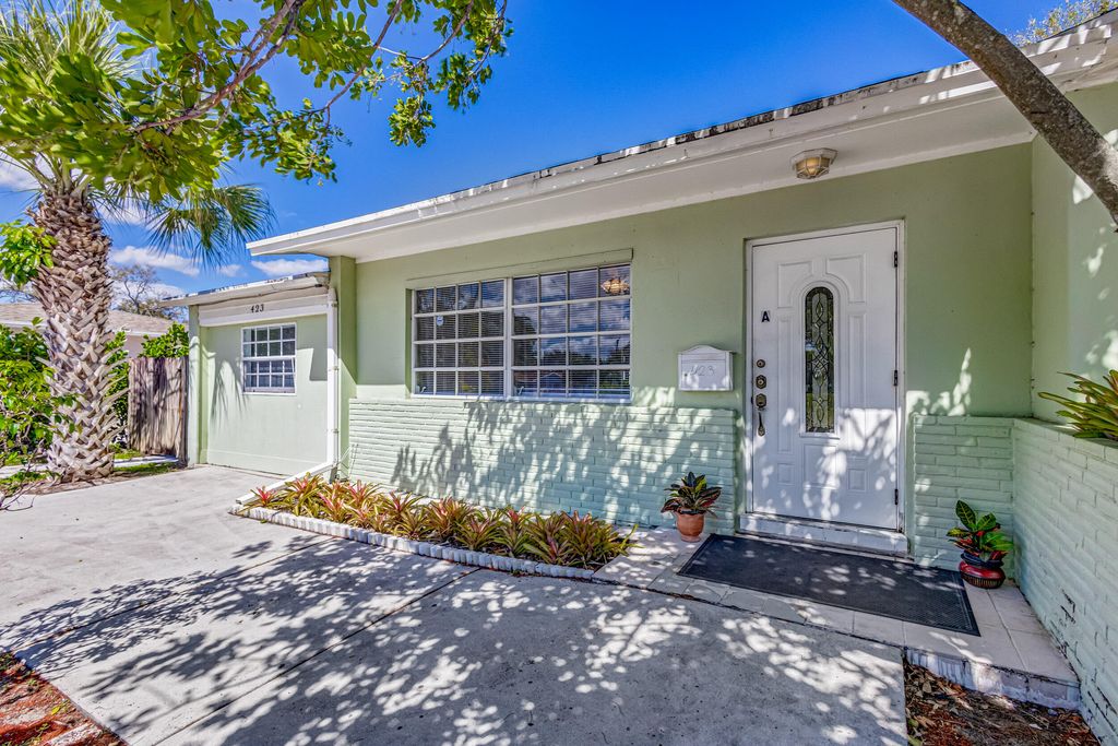 Photo of 423 Date Palm Drive, Lake Park, FL 33403 (MLS # R10964327)