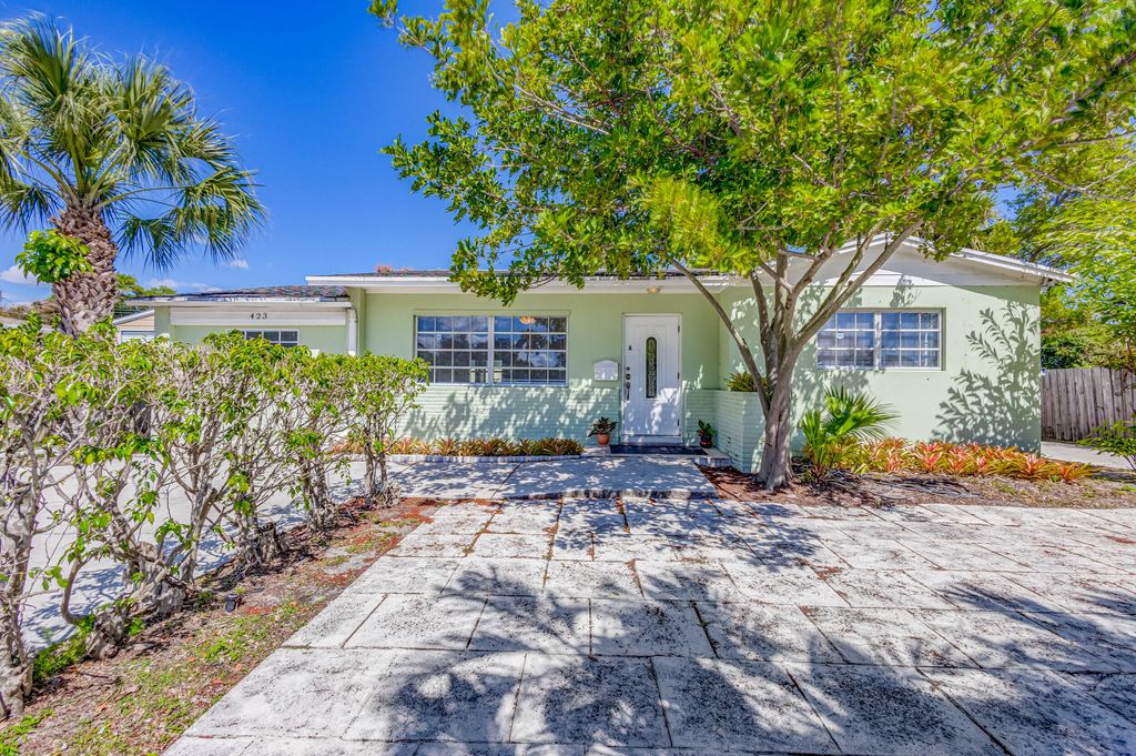 Photo of 423 Date Palm Drive, Lake Park, FL 33403 (MLS # R10964327)