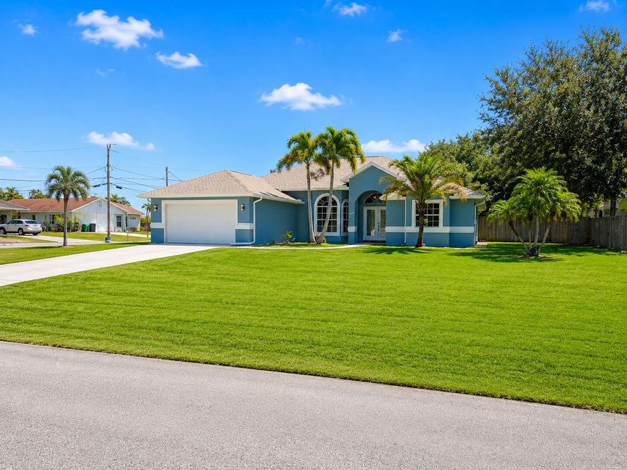 Hidden gem tucked away on a quiet corner lot in the highly desirable Tradition area, with NO HOA! This beautifully updated 4 bedroom, 2 bath home offers the perfect blend of privacy, convenience, and comfort. Featuring a split floor plan, vaulted ceilings, and an abundance of natural light, the home feels bright and spacious throughout. Recent upgrades include a new roof and fresh paint. Enjoy the large fenced backyard with plenty of room for a pool, screened lanai, and no neighbor directly across the street for added privacy.  Conveniently located just 2 minutes to the I-95 Crosstown entrance/exit, perfect for commuters while still being close to Tradition's shopping, dining, and amenities.