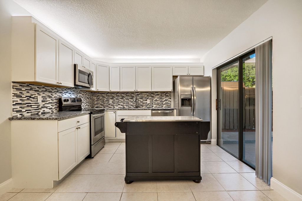 Photo of 2403 24th Lane, Palm Beach Gardens, FL 33418 (MLS # B26011223)