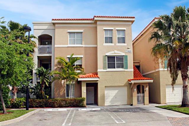 Enjoy lake views from this beautiful 2 bedroom 2 bathroom condo. Kitchen features wood cabinets and granite countertops. Wood Flooring Throughout. Once car detached garage come with the unit. Walk to shopping, resturants and more. Close to Downtown at the Gardens and the Gardens Mail. No Carpet!
