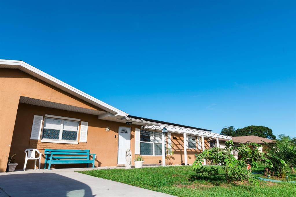 Photo of 435 SE Asbury Lane, Port Saint Lucie, FL 34983 (MLS # R10732236)