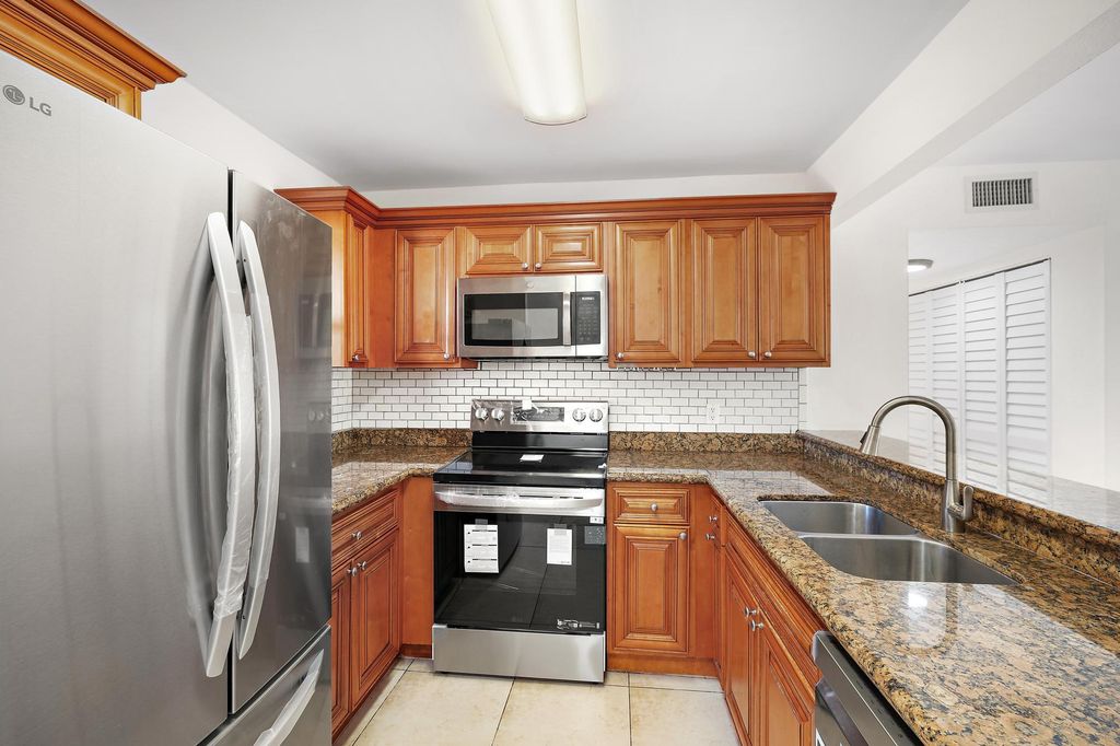 Photo of 1661 Balfour Point Drive #B, West Palm Beach, FL 33411 (MLS # R11167834)