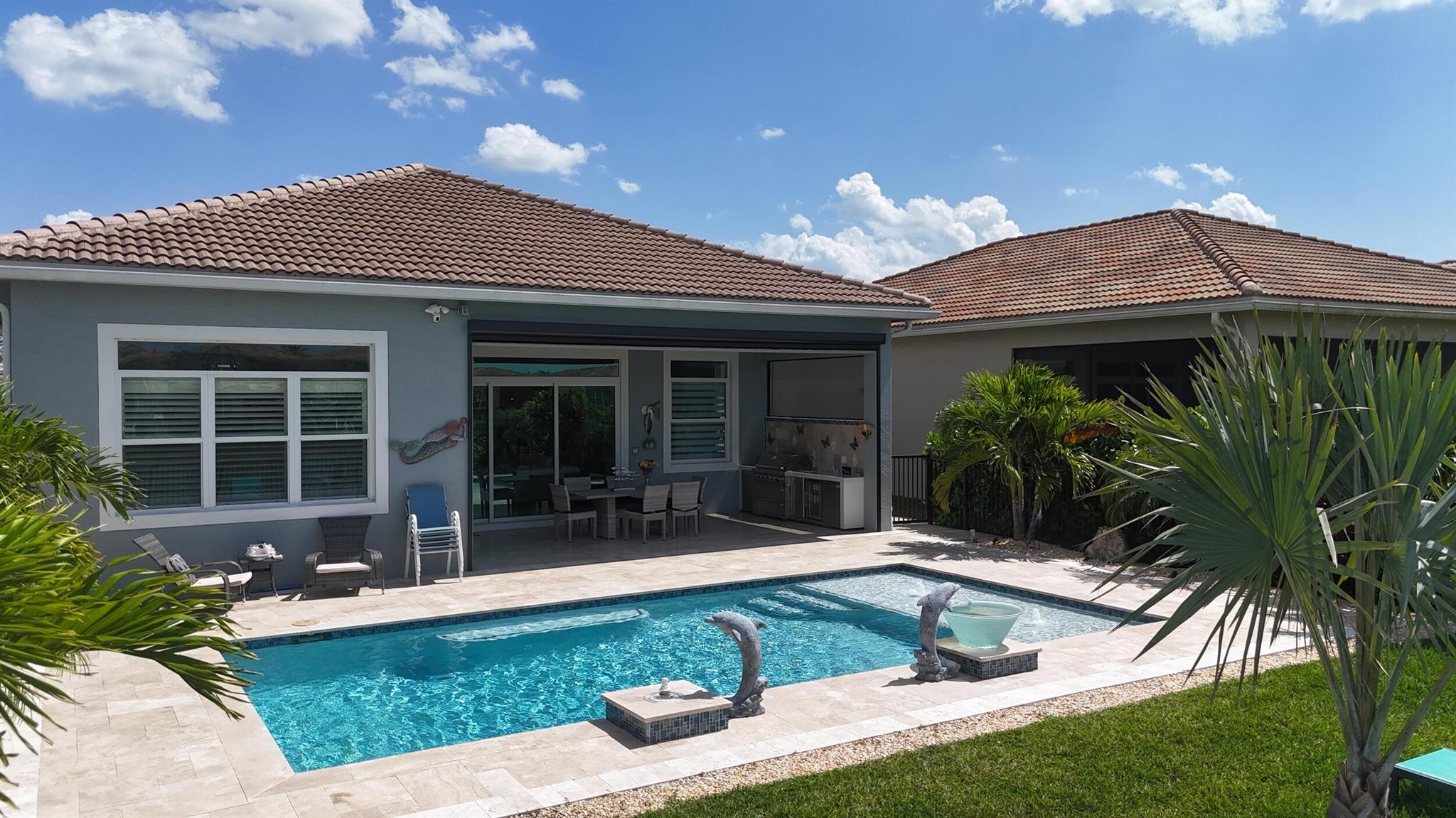 Enjoy resort-style living in the vibrant 55+ community of Cresswind! This fully furnished 2 bedroom + den, 2 bath, 2-car garage home is the perfect rental. Step into your own backyard oasis--ideal for soaking up the Florida sunshine. Relax by the private pool, fire up the outdoor kitchen, catch a game on the mounted TV, and enjoy the comfort of a retractable screen that encloses the covered patio area. Inside, you'll find an open and spacious floor plan with tile flooring throughout for easy maintenance, impact glass windows and doors, and a fully stocked kitchen that opens up to the great room. Den doubles as another bedroom with convertible bed.