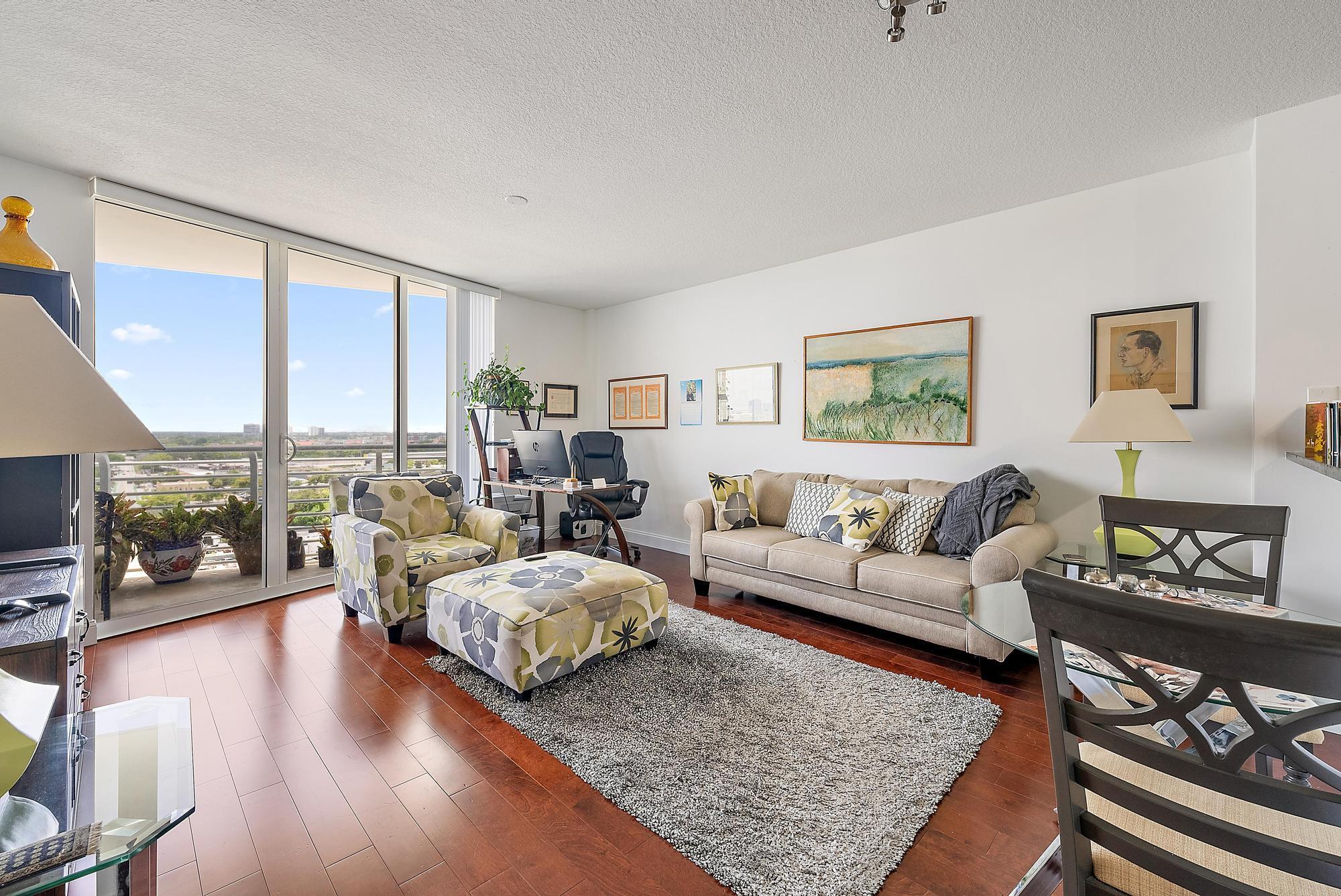Investor Opportunity! Corner Residence with Stunning Sunset ViewsWelcome to Residence 1410 at The Slade, a bright and airy 1-bedroom, 1-bathroom corner unit offering 760 square feet of well-designed living space. Positioned on the 14th floor, this west-facing residence enjoys spectacular sunset views and overlooks the building's serene west pool from a private covered balcony.This unit features a blend of tile and hardwood flooring, and is filled with natural light through expansive floor-to-ceiling hurricane impact sliding glass doors. The open-concept layout enhances the sense of space and comfort, ideal for both living and entertaining.Currently leased at $2,200/month until May 1, 2026, this is a prime investment opportunity in one of West Palm Beach's most desirable