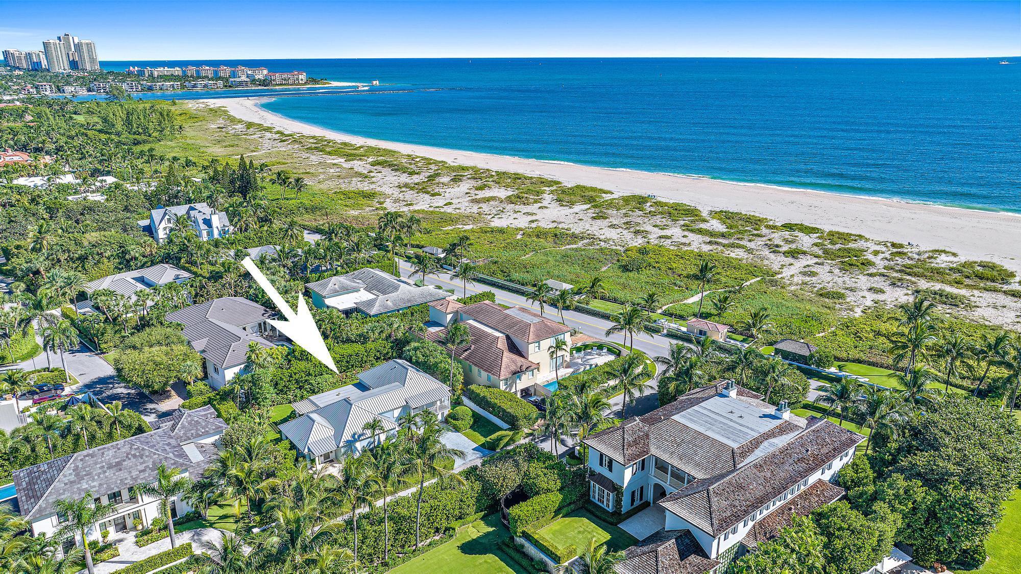 Rare north-end 4 BR, 3.1 BA, with 2-car garage offering an easy laid-back opportunity to embrace Palm Beach's unique tranquility only one house away from the ocean & close Bike Trail access. Relax in the covered-loggia or the nearby shared oceanfront cabana with a covered area, patio furniture, fire pit & running water. This home is on one of the highest elevations on Reef Road. Move-in ready with a new primary bath & impact windows. Should you prefer to renovate more fully, the property includes Architectural Com. (ARCOM) approved plans by Tralango & Taylor including a bar, gym, 50' lap pool, outdoor fireplace, landscaping & other luxury features. The north-end is home to the quietest beaches on Palm Beach & is only a 10 minute drive from The Royal, Worth Ave., restaurants & markets.