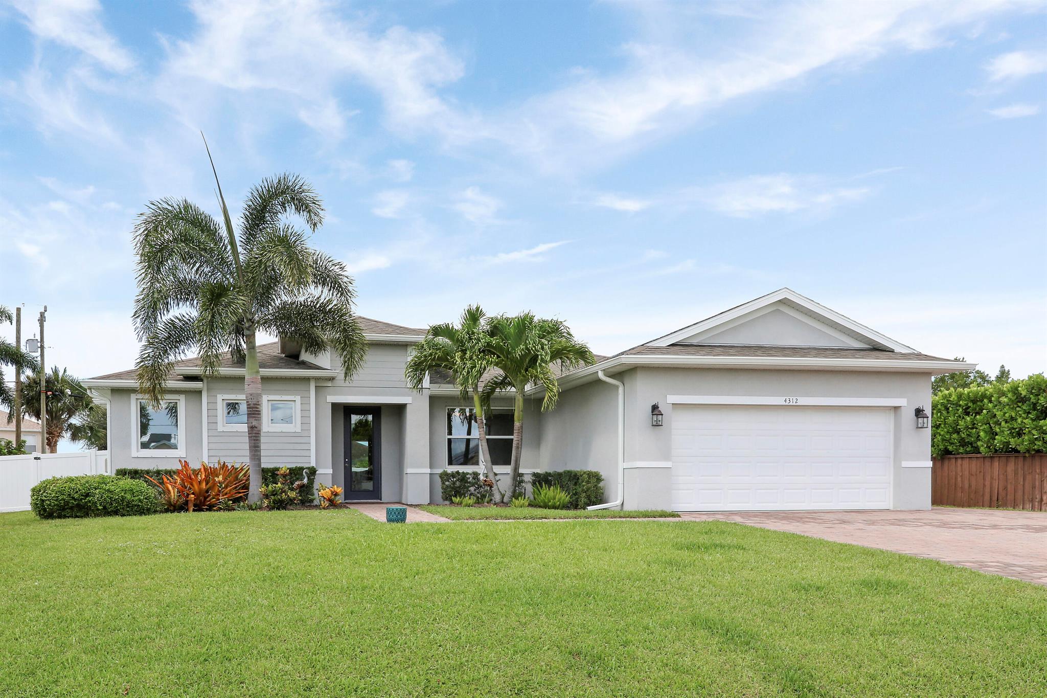Welcome to this stunning CBS home with 10-ft ceilings, 9-ft doorways, and oversized closets! This 3BD/2BA split floor plan offers a bright, open layout with a spacious kitchen, large living room perfect for entertaining, and a private primary suite with dual closets and en-suite bath. Features include a whole house generator, covered patio, laundry room with storage, two-car garage, fully fenced yard, and plenty of room for your boat, RV, and toys. Conveniently located near I-95, the Turnpike, shopping, and schools, this home offers comfort, style, and lasting value in a prime Port St. Lucie location!