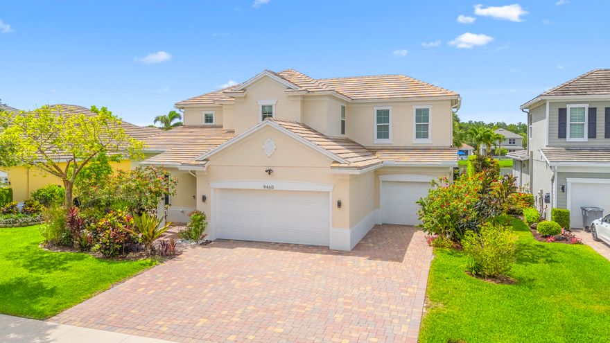 Welcome to a truly one-of-a-kind luxury lakefront estate where no expense has been spared—offering over 3,500 square feet of meticulously upgraded living space and resort-style outdoor living at its finest. Built in 2014, this exceptional 5-bedroom, 3.5-bathroom residence perfectly blends elegance, functionality, and design, immediately impressing with soaring 20-foot ceilings, expansive double-height living areas filled with natural light, a dramatic custom wood and wrought-iron staircase, engineered hardwood flooring, extensive crown molding, oversized 7-inch baseboards, designer LED lighting, elegant tray ceilings, and exceptional attention to detail throughout. Designed for both luxurious everyday living and grand-scale entertaining, the spectacular chef's kitchen was beautifully upgraded in 2023 and serves as the true centerpiece of the home, featuring stunning quartz countertops and full quartz backsplash, a massive waterfall-edge quartz island ideal for entertaining, premium cabinetry, newer stainless-steel dishwasher and microwave, and a top-of-the-line Kohler faucet. The seamless flow between the kitchen, dining, and living spaces—enhanced by a wall of oversized sliding glass doors—creates the perfect indoor-outdoor lifestyle while maintaining warmth and comfort for everyday living. The luxurious first-floor primary suite offers the ultimate private retreat, featuring direct access to the resort-style backyard and pool area along with an enormous custom California-style walk-in closet designed for exceptional organization and storage. Upstairs, you'll find four additional spacious bedrooms, beautifully upgraded bathrooms including a large Jack-and-Jill layout, and a spacious open loft-style walkway overlooking the grand living space below, further enhancing the home's dramatic architectural design.  Step outside into your own private tropical oasis where the backyard truly becomes a showpiece of the property. Situated on a premium oversized lakefront lot, this breathtaking outdoor space is designed for seamless indoor-outdoor living and year-round enjoyment. It features a custom-designed saltwater pool with elegant water features and a sun shelf lounging area, expansive travertine decking, lush tropical landscaping, and mature privacy hedges offering a tranquil and secluded setting. The covered patio is enhanced by a retractable awning—perfect for creating additional shade and comfort while enjoying outdoor dining or relaxing poolside—alongside a fully equipped outdoor summer kitchen complete with built-in grill, sink, and refrigerator. The expansive backyard offers exceptional space for entertaining, children, pets, and enjoying beautiful waterfront views and sunsets.  This extraordinary property is loaded with high-end upgrades and improvements including full impact windows and doors throughout, impact-rated garage doors, painted garage flooring, zebra blinds, California closets, Ecobee smart thermostat, a 2025 Daikin upstairs A/C system with transferable 15-year warranty, a 2023 high-efficiency water heater with expansion tank, and extensive 2026 pool equipment upgrades including a new pool pump, filter, and motor. Completing the package is an expanded driveway capable of accommodating up to 10 vehicles including the spacious 3-car garage — a rare and highly desirable feature.  Located within a quiet and intimate community of approximately 80 homes, this property offers the perfect balance of privacy and convenience, just minutes from top-rated schools, fine dining, shopping, major highways, and airports—placing you close to everything while still enjoying a peaceful, upscale neighborhood setting.