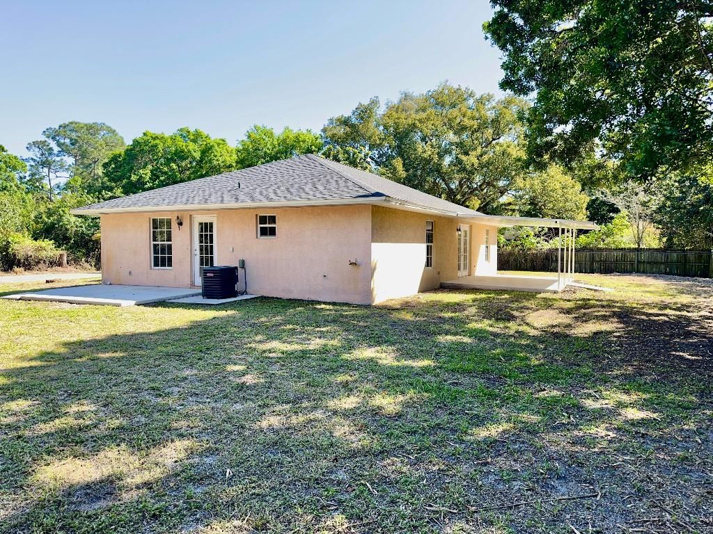 Photo of 620 W Weatherbee Road, Fort Pierce, FL 34982 (MLS # R10962206)
