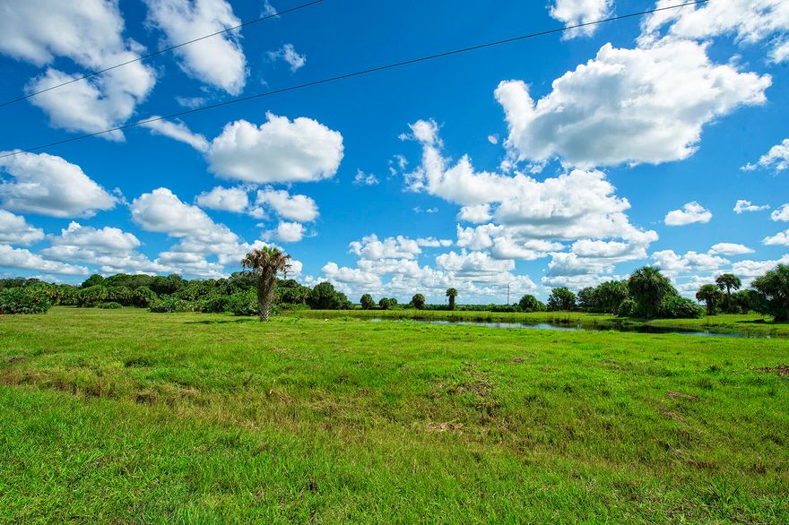 250+ acres of Freedom! Heading for your Country Retreat in Martin County! This ultimate country lifestyle can be yours!  No HOA. Bring your animals, toys & hunting gear. Feel like you are in the middle of nowhere yet only 12 minutes to I95; close to Palm City, Indiantown & Okeechobee (world class fishing, Lake O!) See the sunset, see all the stars sitting on the porch of the 4/2 modular or practice shooting on the range with bathroom & storage. Imagine driving your 4 wheeler thru massive old trees & picturesque meadows or follow along the beautiful creek meandering thru the land scouting out the Osceola turkeys, white tail deer, hogs & more. Farm, hunt, play or relax when you own the land you decide what to do. South Florida great opportunity. See drone video of the 3 parcels, for 250+ Ac.