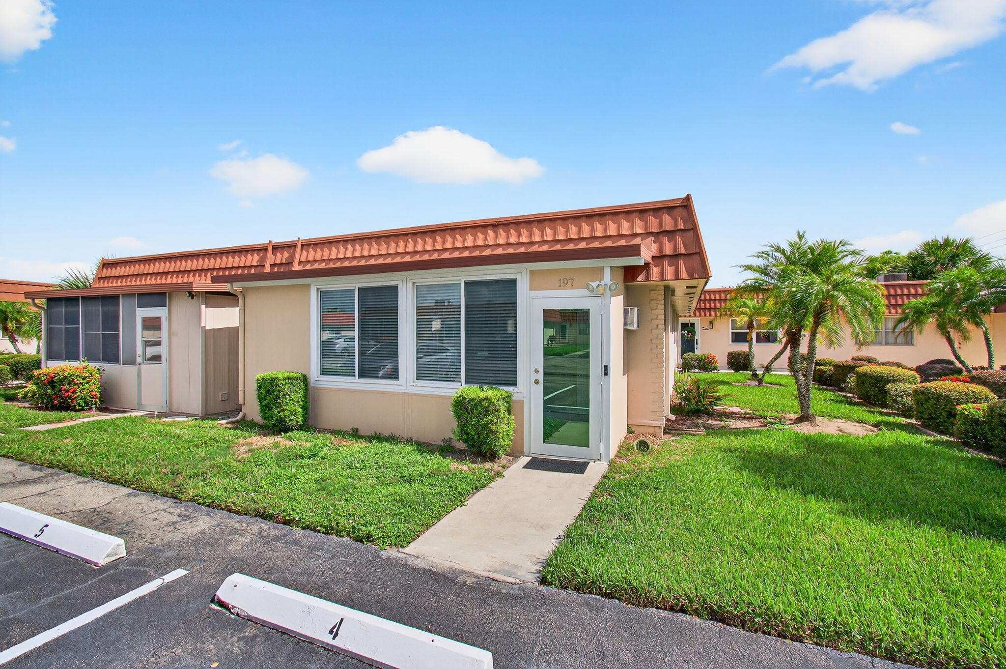 Welcome to this beautifully renovated 2BD/2BA villa in the Seville section of Kings Point, Delray Beach! Features include hurricane-impact windows, slider and doors, newer A/C (2022), tankless water heater (2016), vinyl flooring (no carpet or popcorn ceilings), recessed LED lighting, and an open kitchen with granite countertops and soft-close cabinets. Washer/dryer tucked behind folding doors in the newly renovated Florida room, with storm proof windows and separate wall AC unit. Close to the main clubhouse and all amenities--pickleball, tennis, pools, fitness center, theater, cafe, and so much more. Just minutes to Atlantic Ave, downtown Delray, and the beach. Perfect winter getaway with manned gate for added security!
