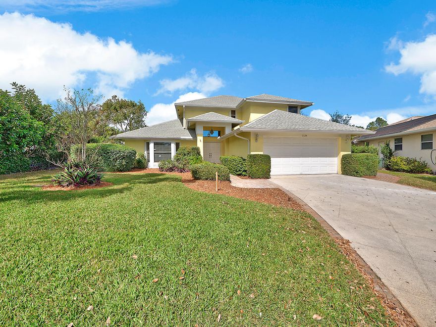 On a quiet cul-de-sac this meticulously maintained home invites comfort. Sitting in your screened, covered lanai looking out at the serene lake view, your family can create new memories and tell old stories. The home has a first floor master bedroom 2.5 baths and 2 car garage with an extra long driveway. There are wood floors throughout the first level and the carpeted areas were just recently replaced. The kitchen has newly renovated white tile counters with matching backsplash, white appliances and a French door refrigerator. Additional features, liked high ceilings and plantation shutters, make this Palm City home a must see! Schedule your preview today.