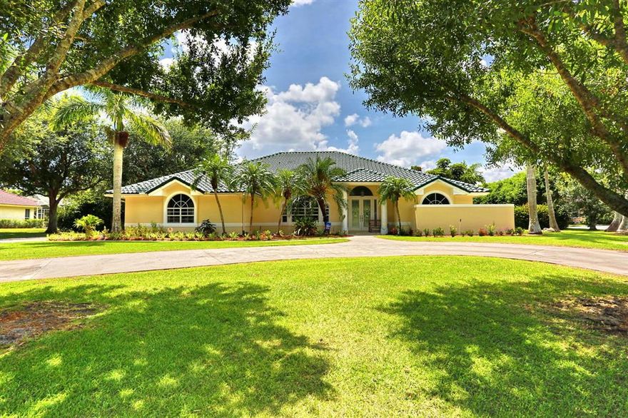 Must Sell Due to Divorce. Appraised in 2017 for 735,000, 80,000 + under market! Beautiful Estate Home with 1 1/3 acre in desirable Steeplechase! When you pull into the grand circular driveway you will be met with lush landscaping consisting of palm trees, oak trees and fruit trees. This 5/3.1/2 pool home features custom impact glass front doors as you enter into the spacious family room with high ceilings, 20 x 20 tiles flooring in the kitchen and living area. The kitchen has light wood cabinets, granite countertops, wine cooler, stainless steel appliances and a skylight. Two living areas, kitchen nook with bay window, separate dining room. Two Bathrooms were remodeled with custom tile walls, rain shower heads, and glass doors. Huge master bedroom with wood flooring, custom bathroom cabi