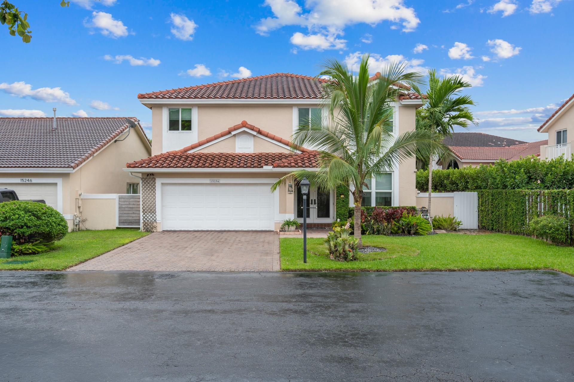 Discover this beautifully maintained 4-bedroom, 2.5-bath home in the desirable Hammocks community with 24-hour guarded security. The extended master suite can easily be converted into a 5th bedroom or home office and also features a large private balcony. Highlights include a 2020 roof, full impact windows and doors, marble floors downstairs, wood hallway floors, wood staircase with custom railings, central vacuum, updated bathrooms with travertine, and plenty of closet space. The updated kitchen offers 3 ovens, 48” cabinets, pull-out pantry drawers, a Lazy Susan, and stainless steel appliances, perfect for entertaining. Enjoy a summer kitchen, lush landscaping, extra guest parking, a spacious 2-car garage, and access to all Hammocks facilities for a true community lifestyle.
