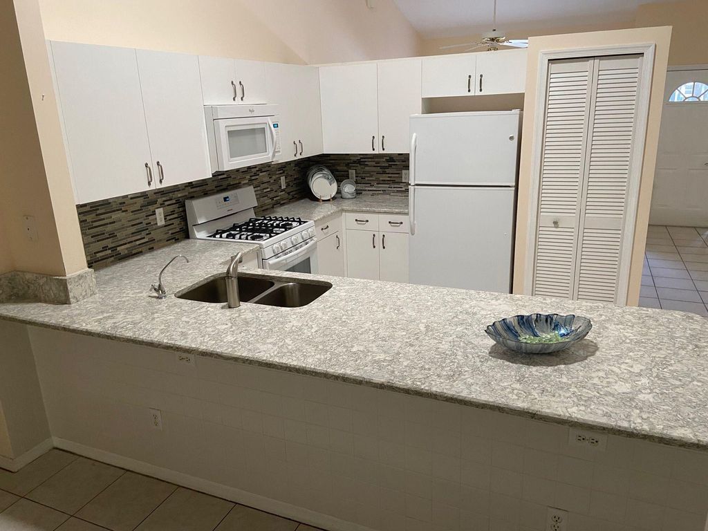 Photo of 430 NW Sherry Lane, Port Saint Lucie, FL 34986 (MLS # R10975652)