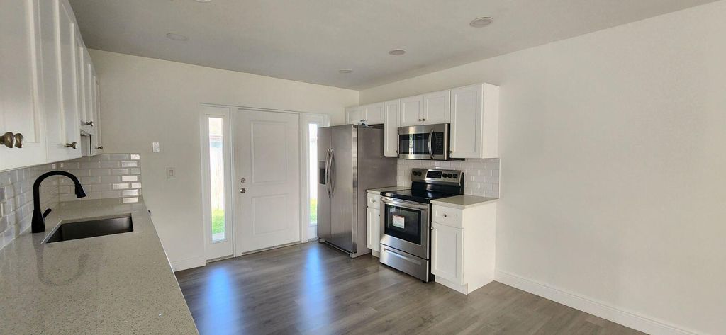 Photo of 9160 W Highland Pines Boulevard, Palm Beach Gardens, FL 33418 (MLS # R11049799)