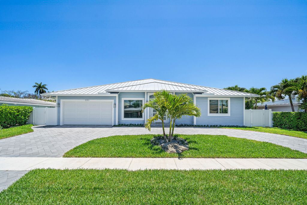 Photo of 830 NE 72nd Street, Boca Raton, FL 33487 (MLS # B26027310)