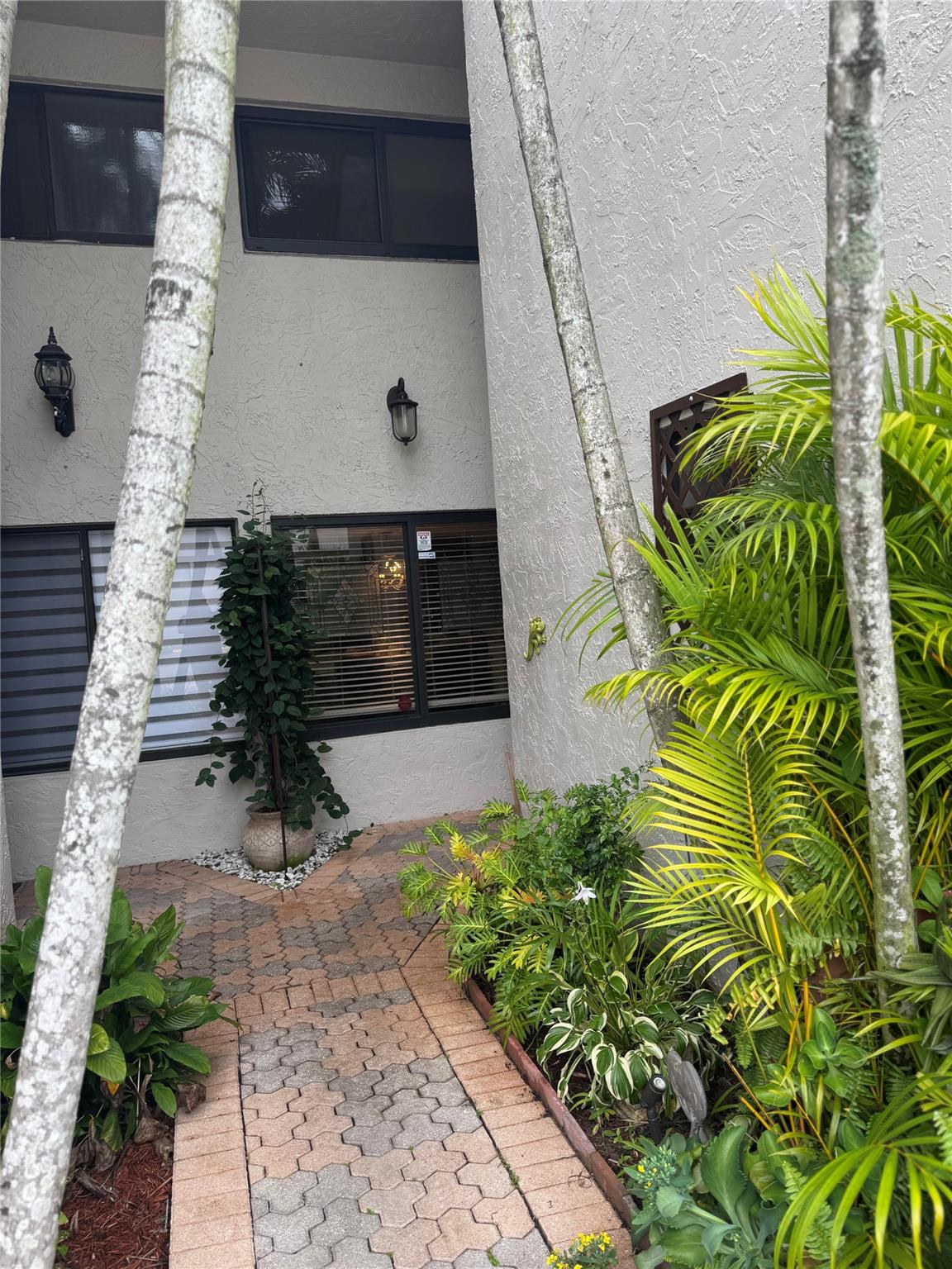 Beautiful 2 story condo located in Jacaranda. This 3 bedroom 2 1/2 bath unit with master bedroom suite that overlooks the golf course. Granite counters in kitchen, built in's, spacious master bedroom with walk-in closet, sitting area in master bedroom, screened patio on first and second floors, impact windows and seperate eat-in kitchen. Third bedroom presently used as art studio. Amenities include pool, tennis court,gym, game room, sauna and club house. There are 2 central air units which helps efficiency plus 2 hot water heaters. All sizes and ages are apx