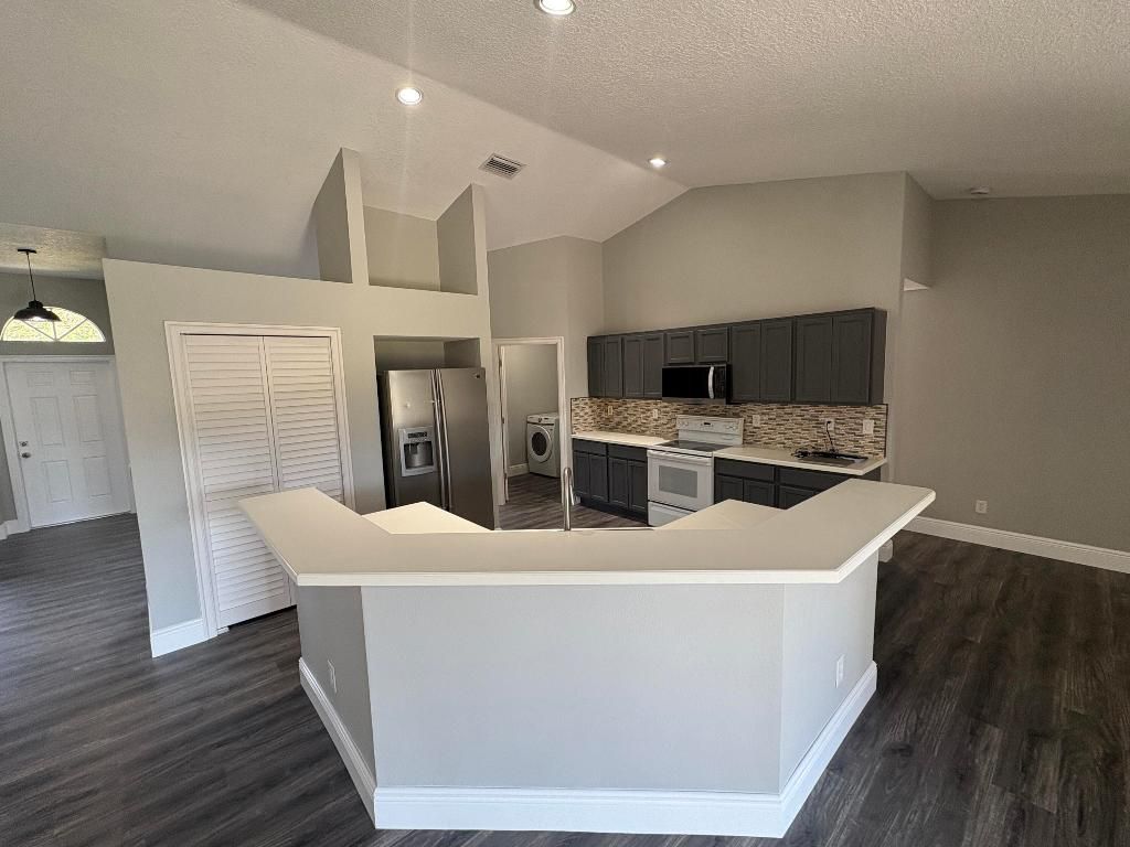 Photo of 1196 SE Puritan Lane, Port Saint Lucie, FL 34983 (MLS # R11147885)