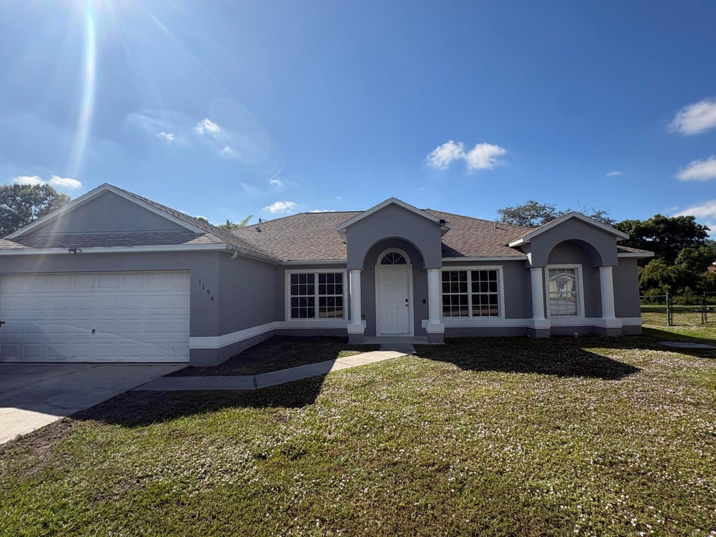 Photo of 1196 SE Puritan Lane, Port Saint Lucie, FL 34983 (MLS # R11147885)