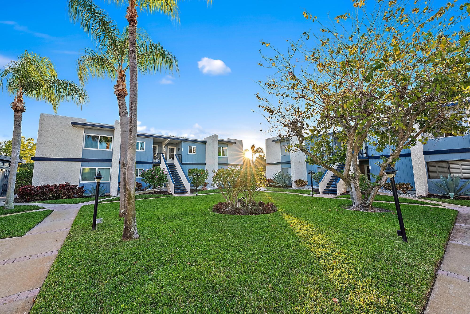 FURNISHED SEASONAL RENTAL! October 2025 - April 2026. EXQUISITE 2-bedroom, 2-bathroom condo in the highly sought-after 55+ community of Beacon 21 Condo C in Jensen Beach! This spacious second-floor unit boasts 1,272 square feet of living space, an enclosed glassed-in porch, a beautifully updated interior with tile flooring throughout, and a 2024 roof, a 2022 AC, and a 2022 water heater.Step inside to find a charming kitchen immediately to your right, featuring modern appliances less than two years old, ample cabinetry, and a bright window with serene outdoor views. Beyond the kitchen, the open-concept dining area flows seamlessly into the expansive living room, creating a perfect space for entertaining. Natural light floods the space, leading you