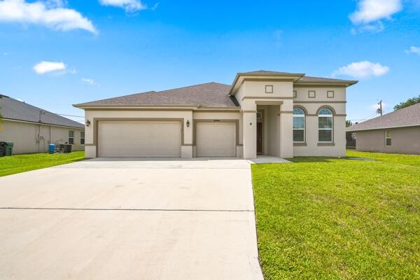 Photo of 1957 SW LOGAN Street, Port Saint Lucie, FL 34953 (MLS # B26052214)